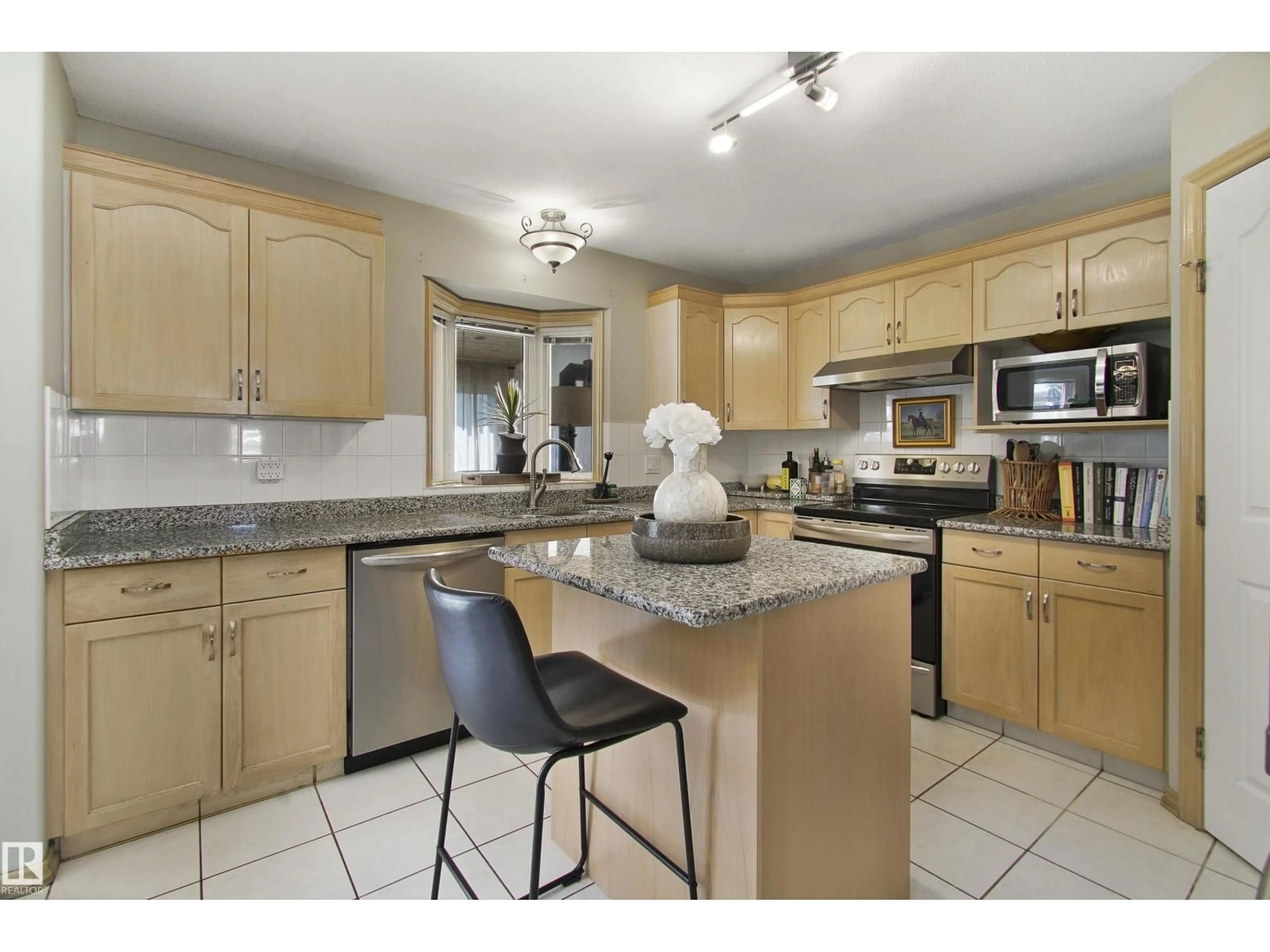 Open concept kitchen, ceramic/tile floor for 8617 158A AV, Edmonton Alberta T5Z3B7
