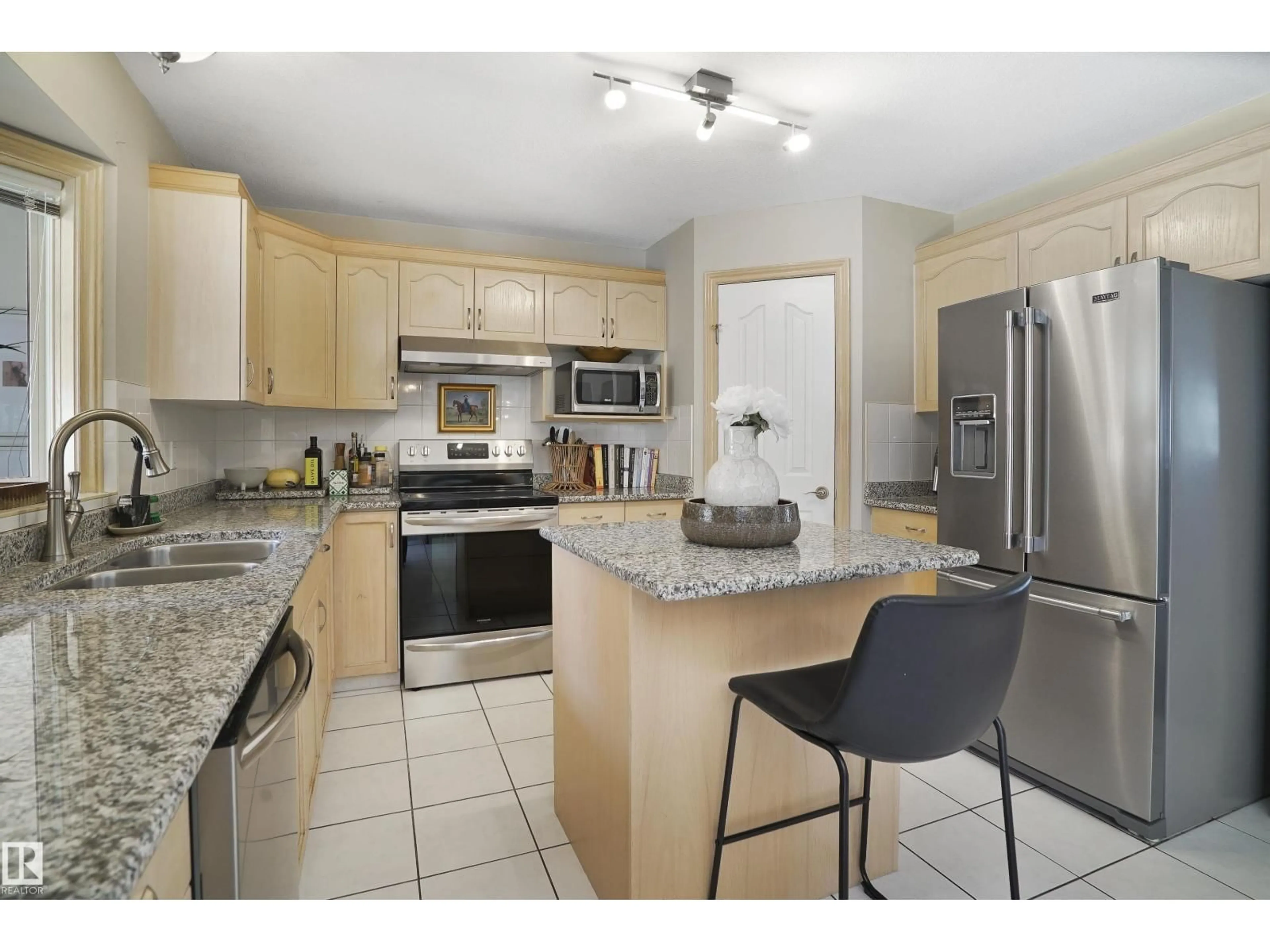 Open concept kitchen, ceramic/tile floor for 8617 158A AV, Edmonton Alberta T5Z3B7