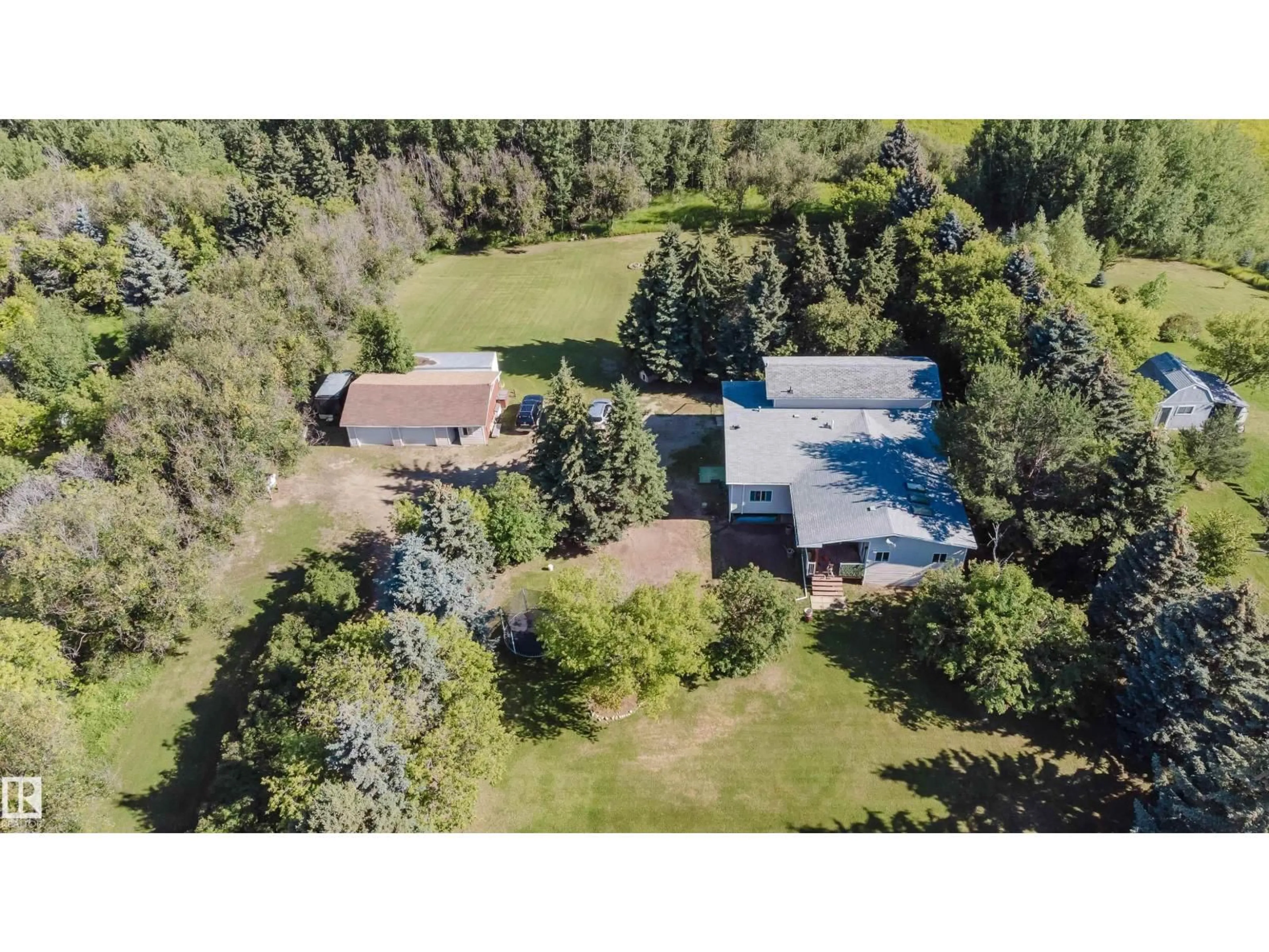 A pic from outside/outdoor area/front of a property/back of a property/a pic from drone, unknown for 53504 - 5 RGE ROAD 14, Rural Parkland County Alberta T7Y0B5