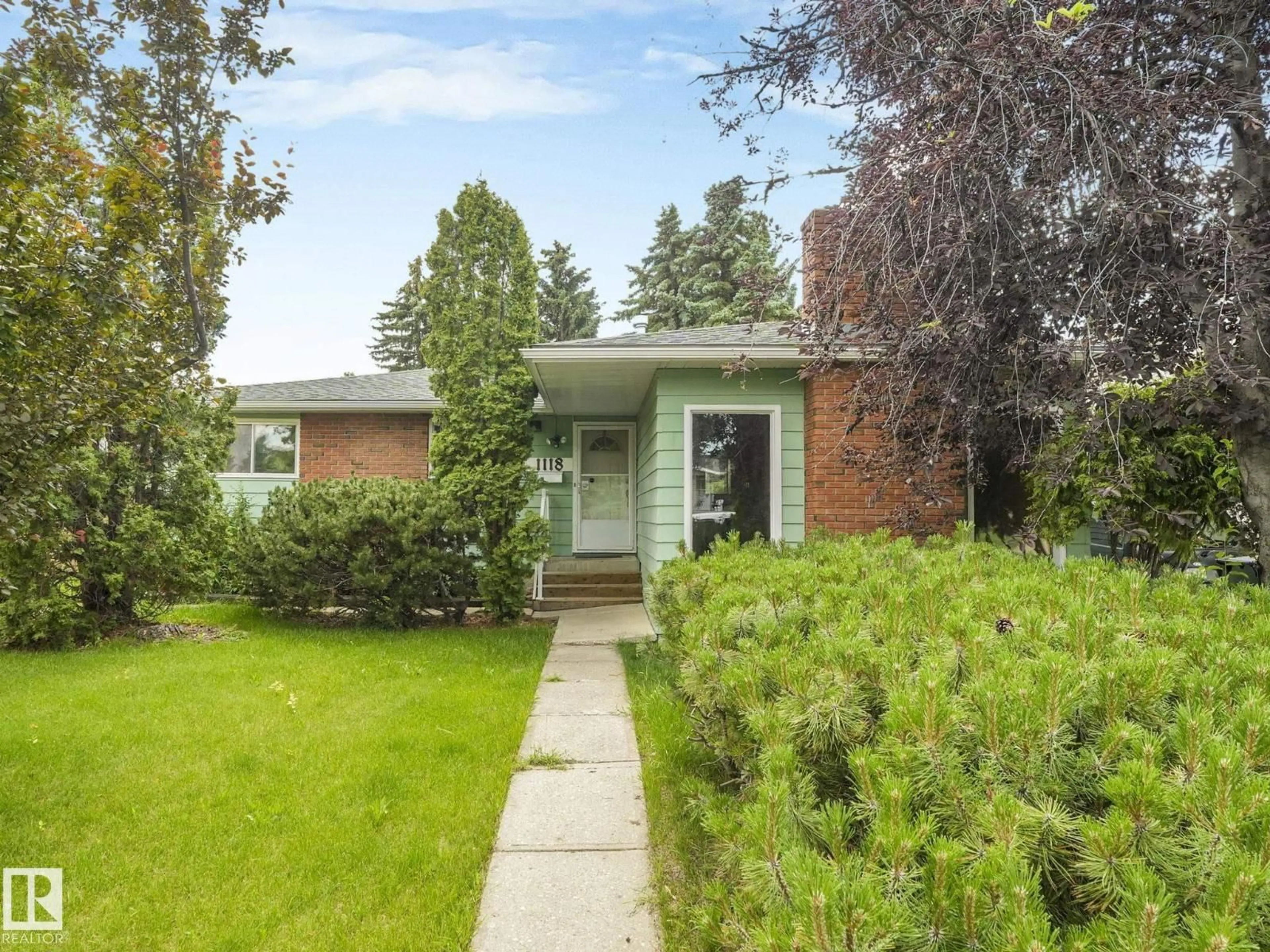 Home with brick exterior material, street for 1118 68 ST, Edmonton Alberta T6K1L1