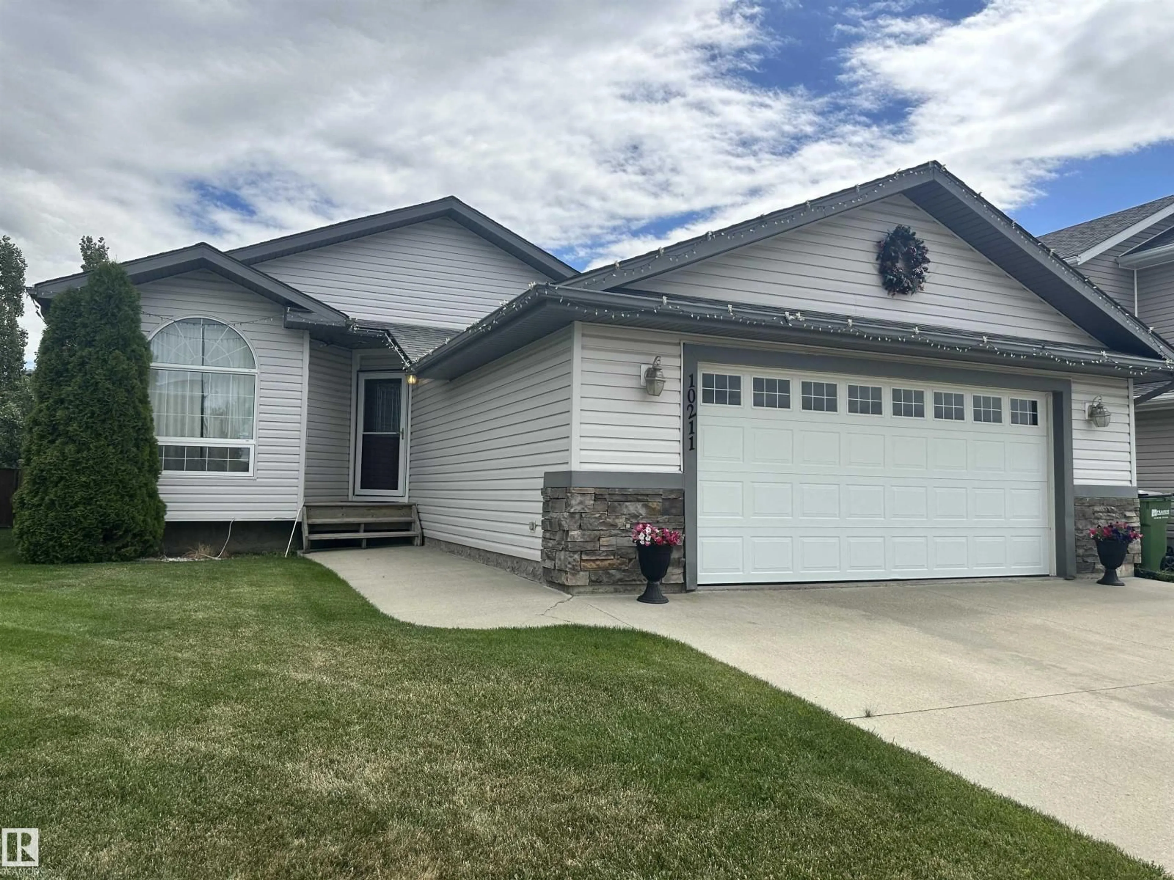 Home with vinyl exterior material, street for 10211 110 AV, Westlock Alberta T7P2S1