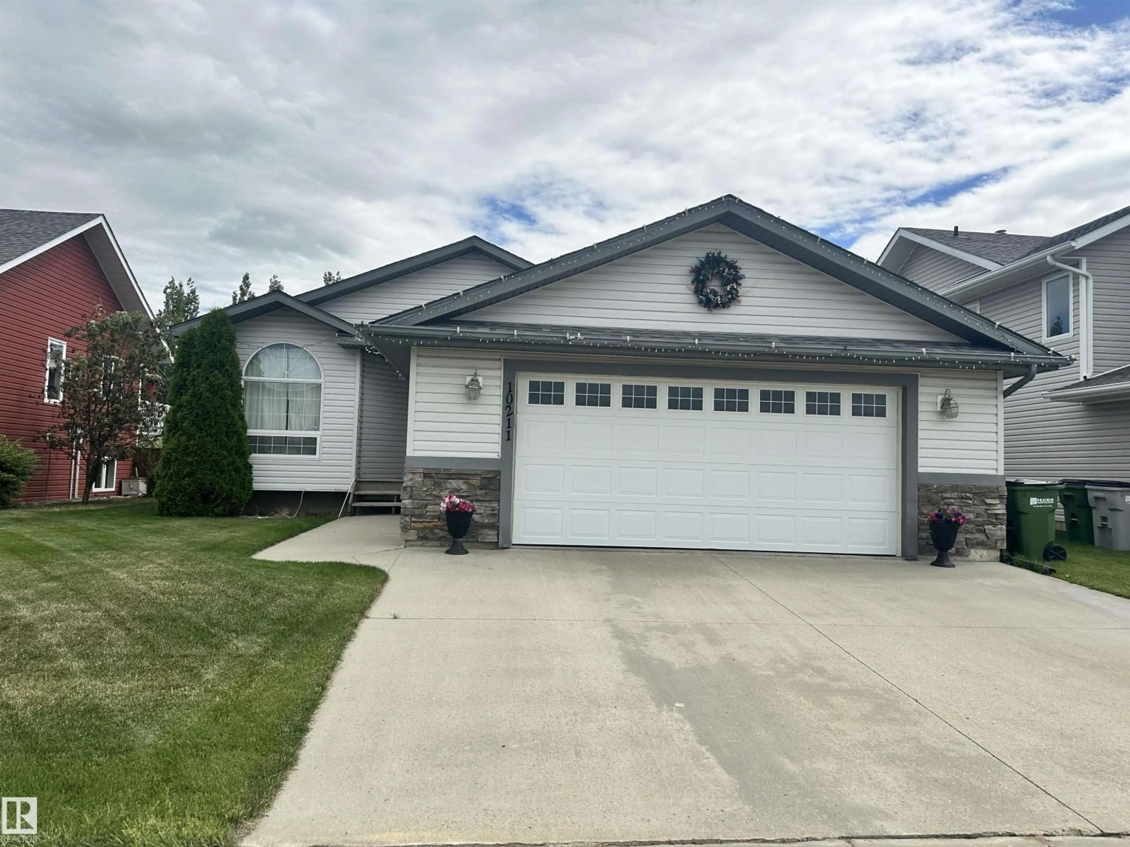 Home with vinyl exterior material, street for 10211 110 AV, Westlock Alberta T7P2S1