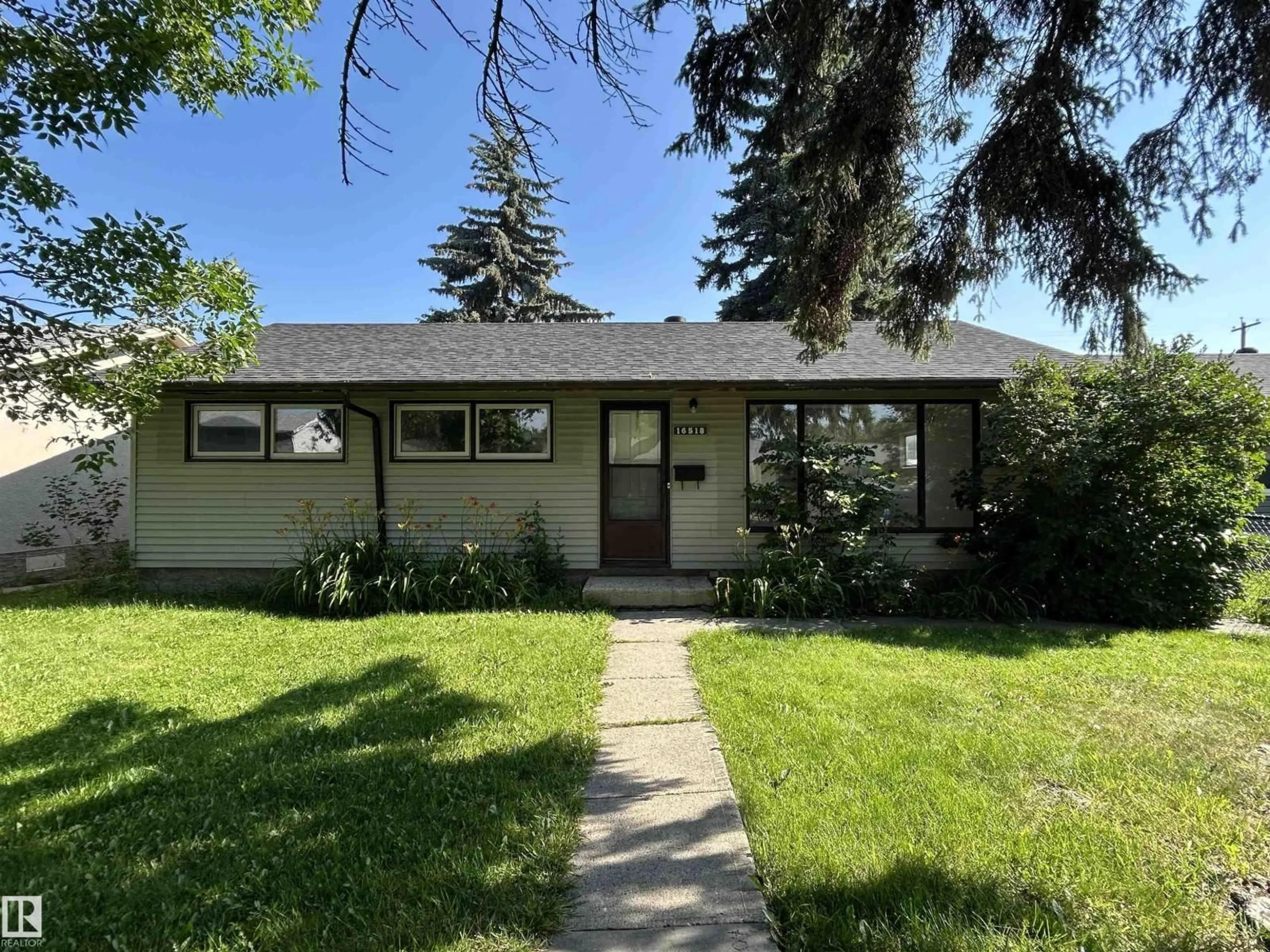 Home with vinyl exterior material, street for 16518 106 AV, Edmonton Alberta T5P0W9