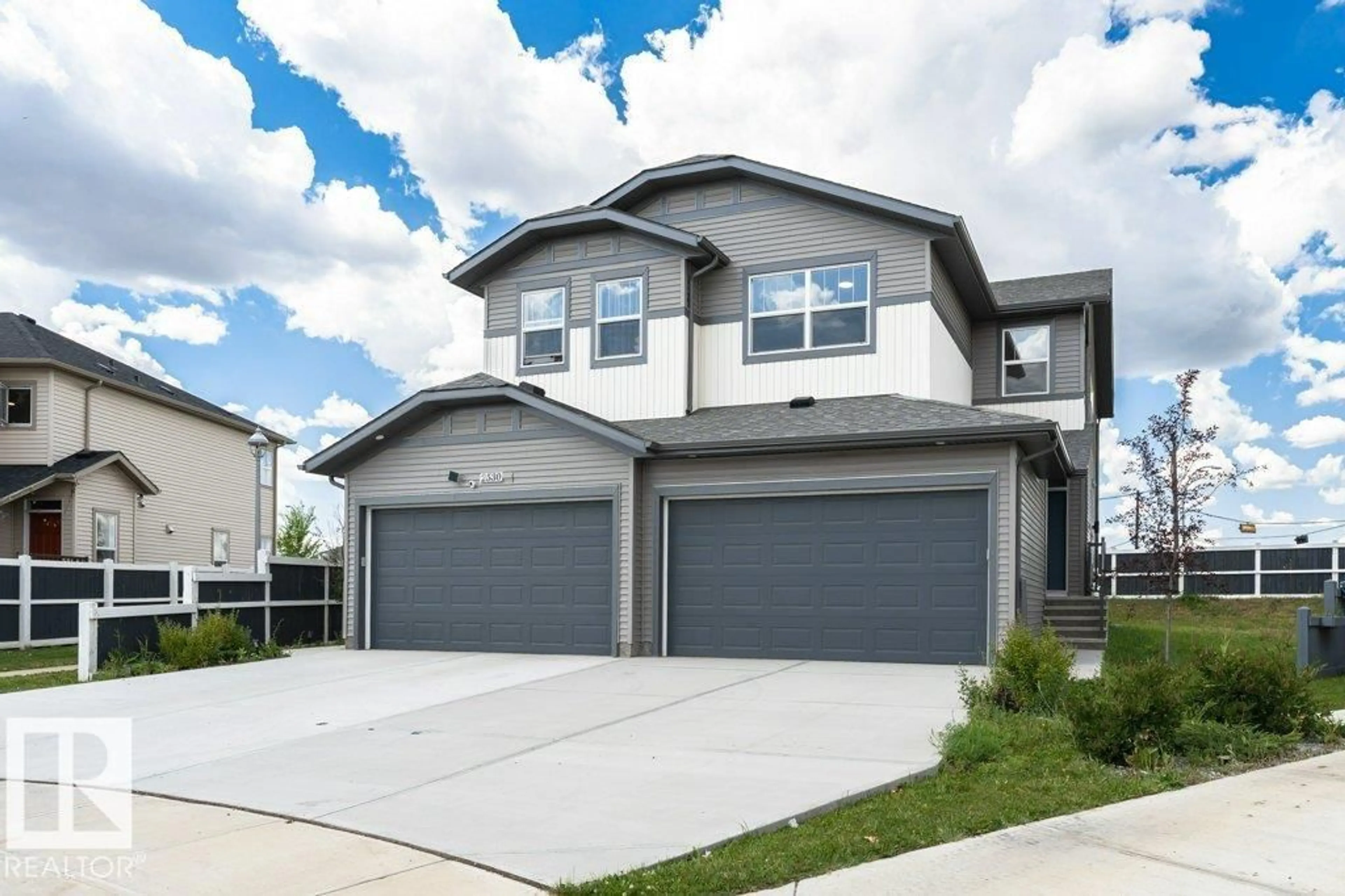 Home with vinyl exterior material, street for NW - 2528 152 AV, Edmonton Alberta T5Y3Z1