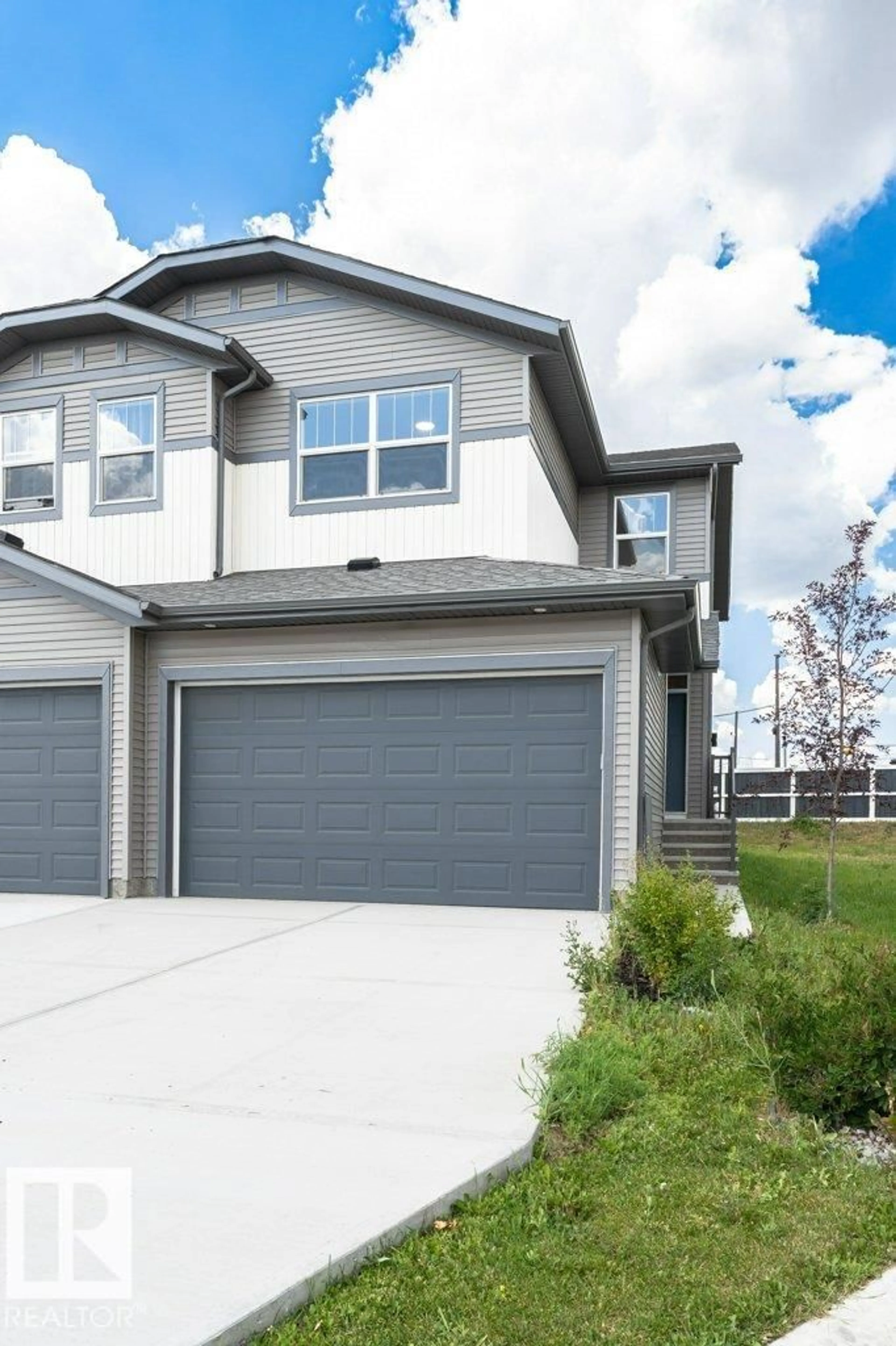 Home with vinyl exterior material, street for NW - 2528 152 AV, Edmonton Alberta T5Y3Z1