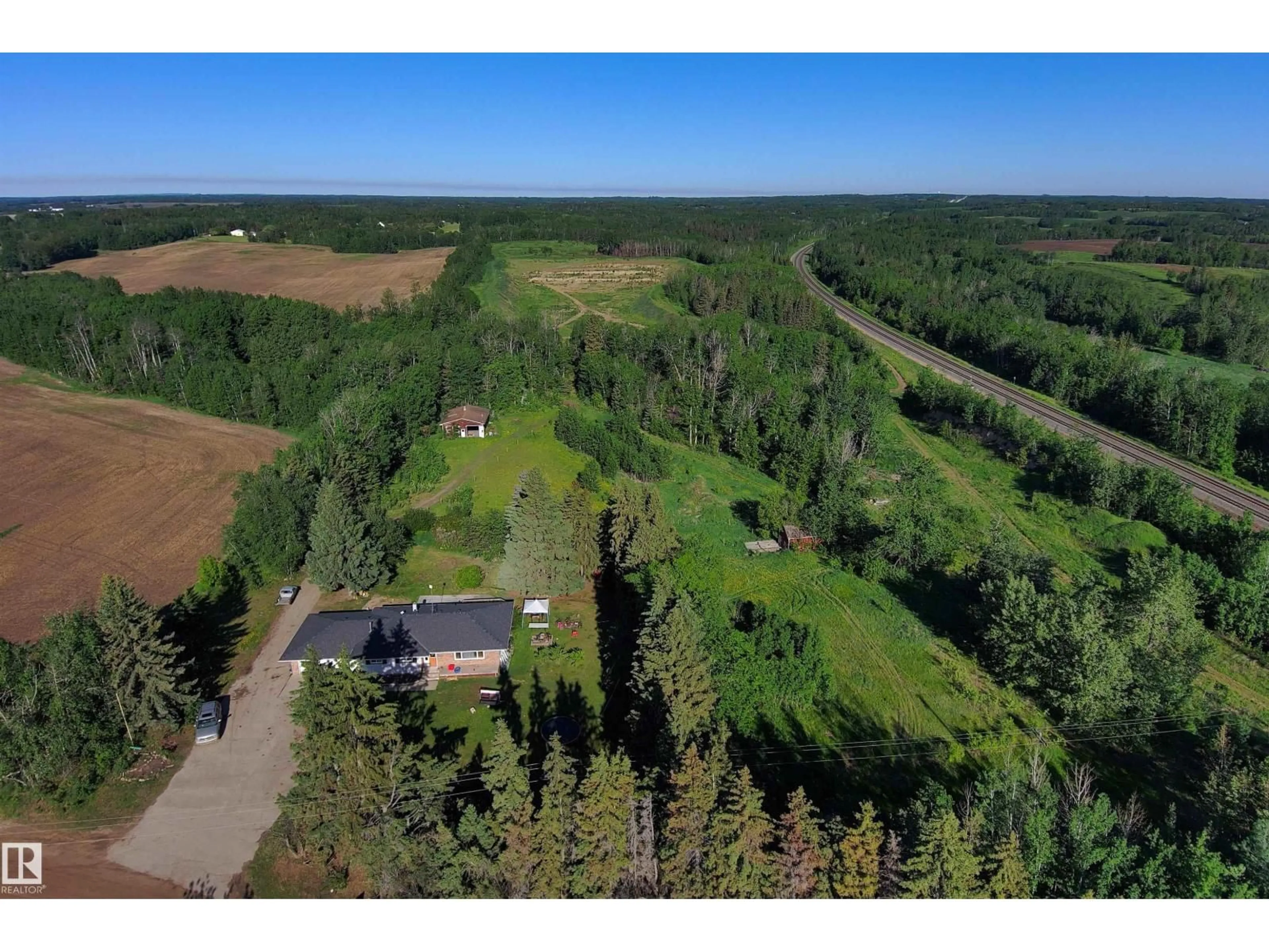A pic from outside/outdoor area/front of a property/back of a property/a pic from drone, forest/trees view for 52502 RGE ROAD 12, Rural Parkland County Alberta T7Y2B9
