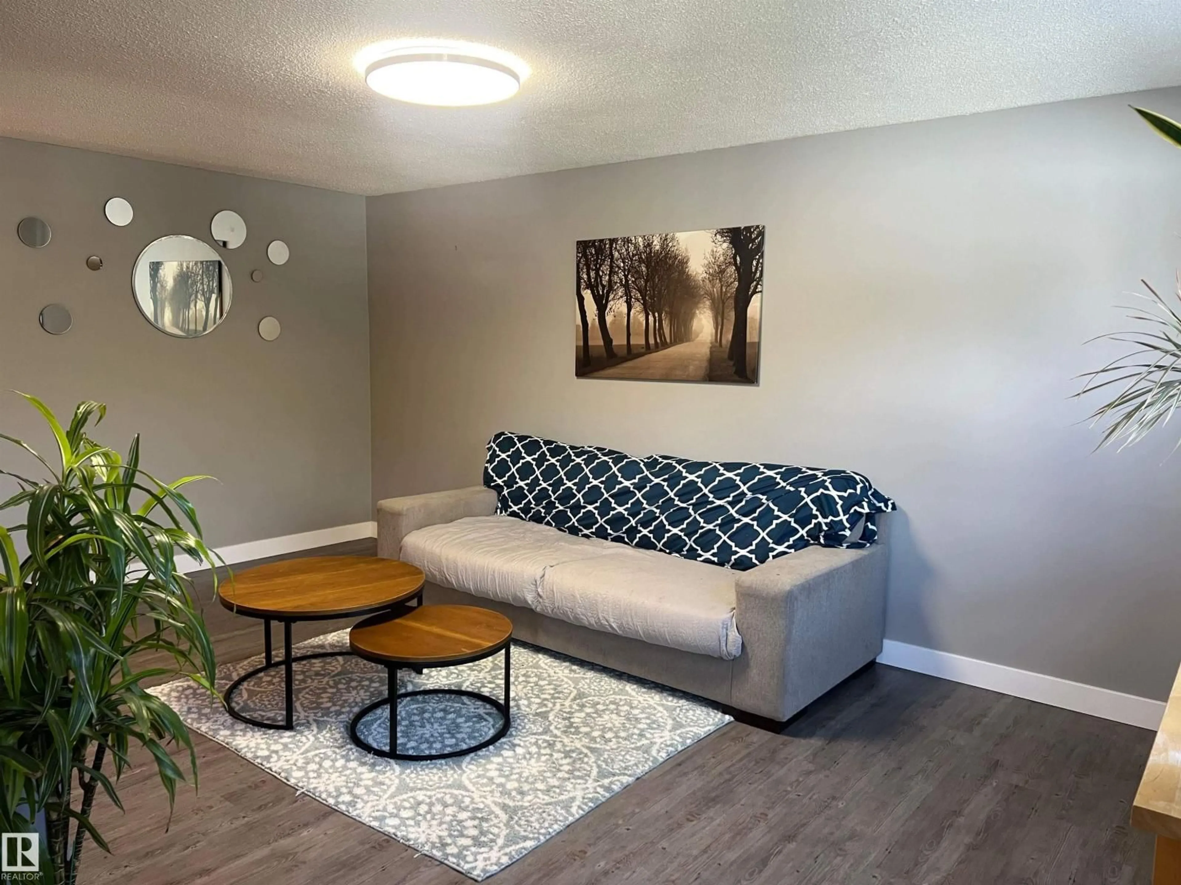 Living room with furniture, wood/laminate floor for 75 HERON RD, Sherwood Park Alberta T8A0H1