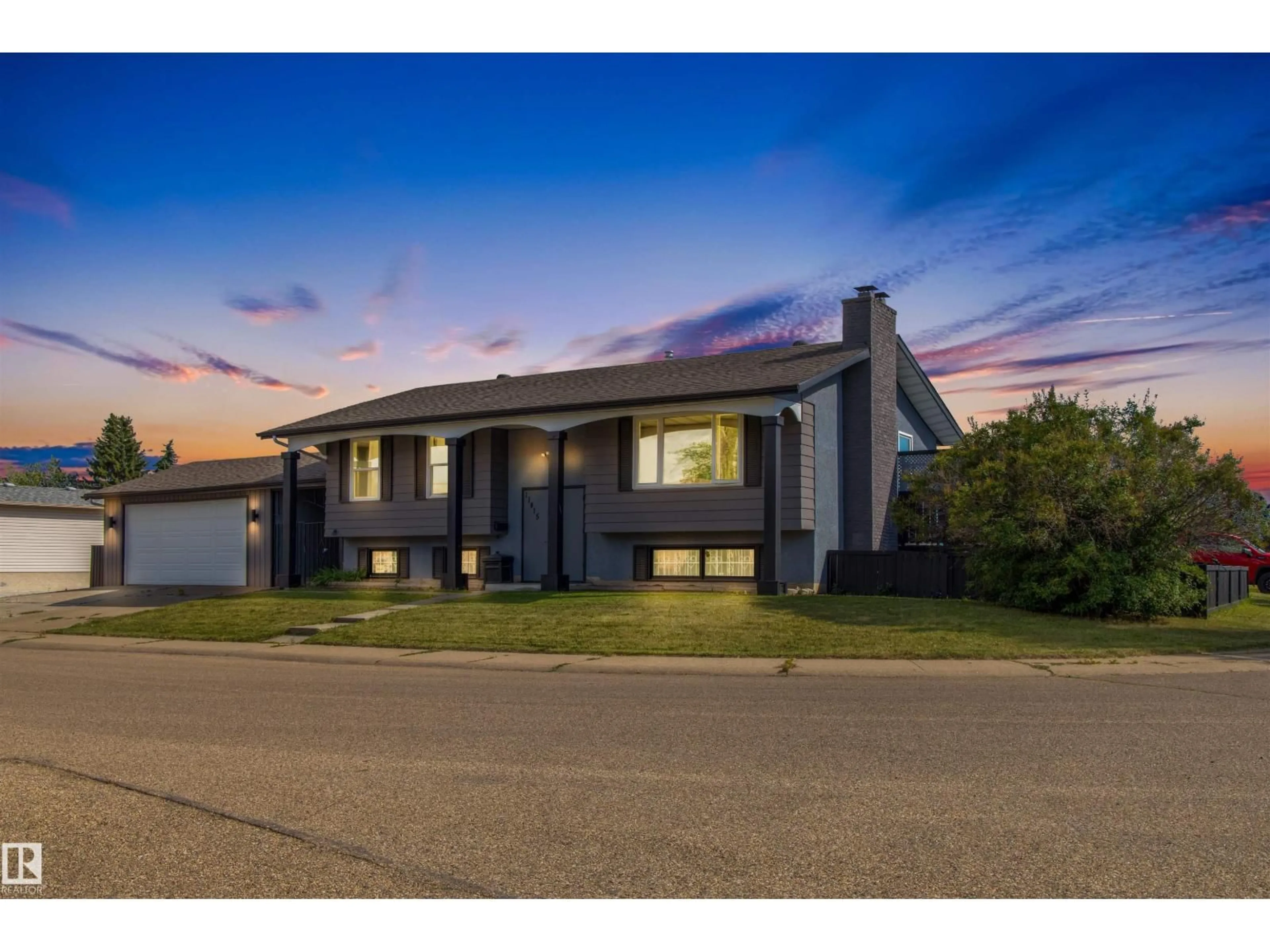 A pic from outside/outdoor area/front of a property/back of a property/a pic from drone, street for 11415 148 AV, Edmonton Alberta T5X1B3