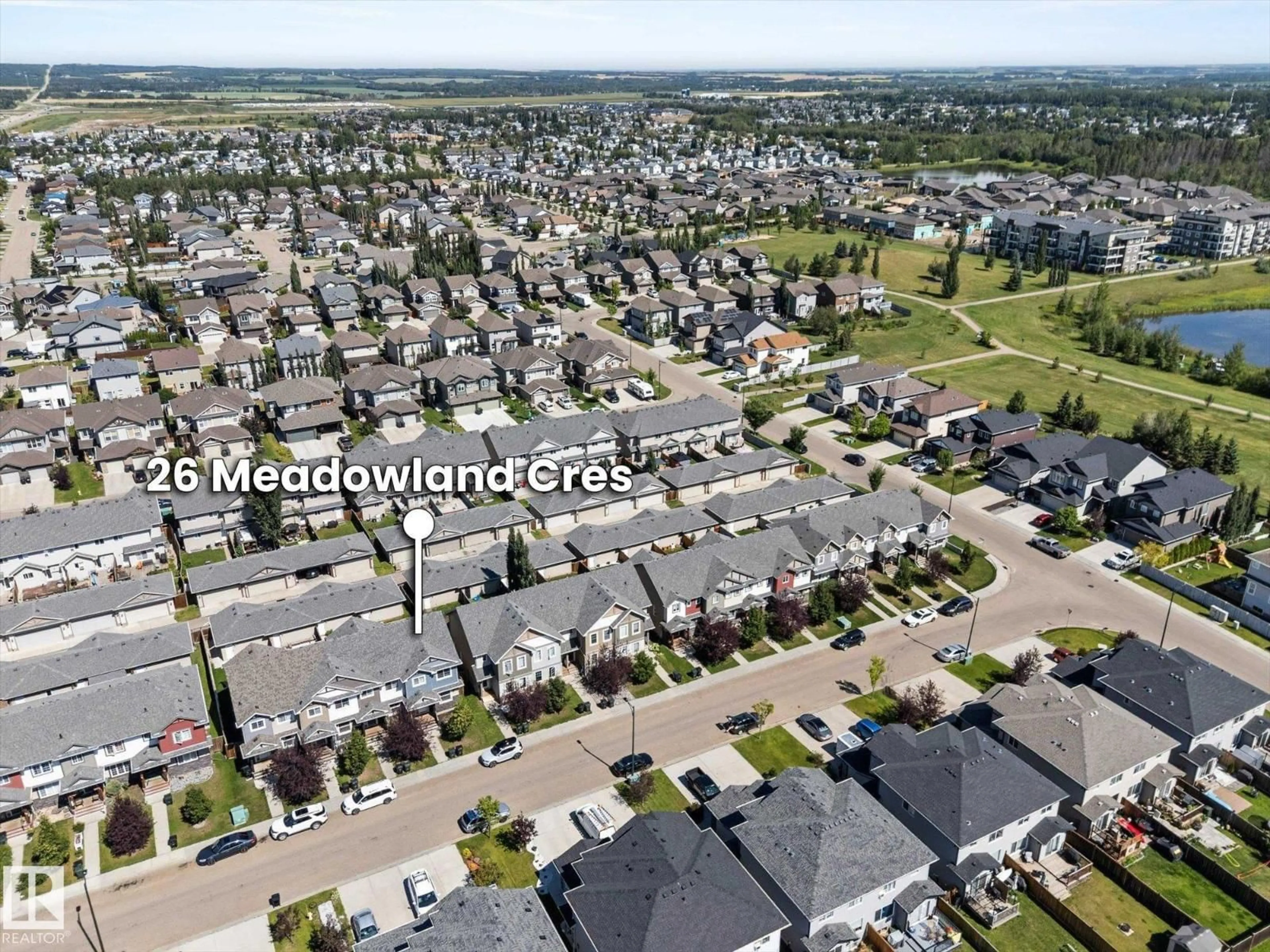 A pic from outside/outdoor area/front of a property/back of a property/a pic from drone, mountain view for 26 MEADOWLAND CR, Spruce Grove Alberta T7X0P9