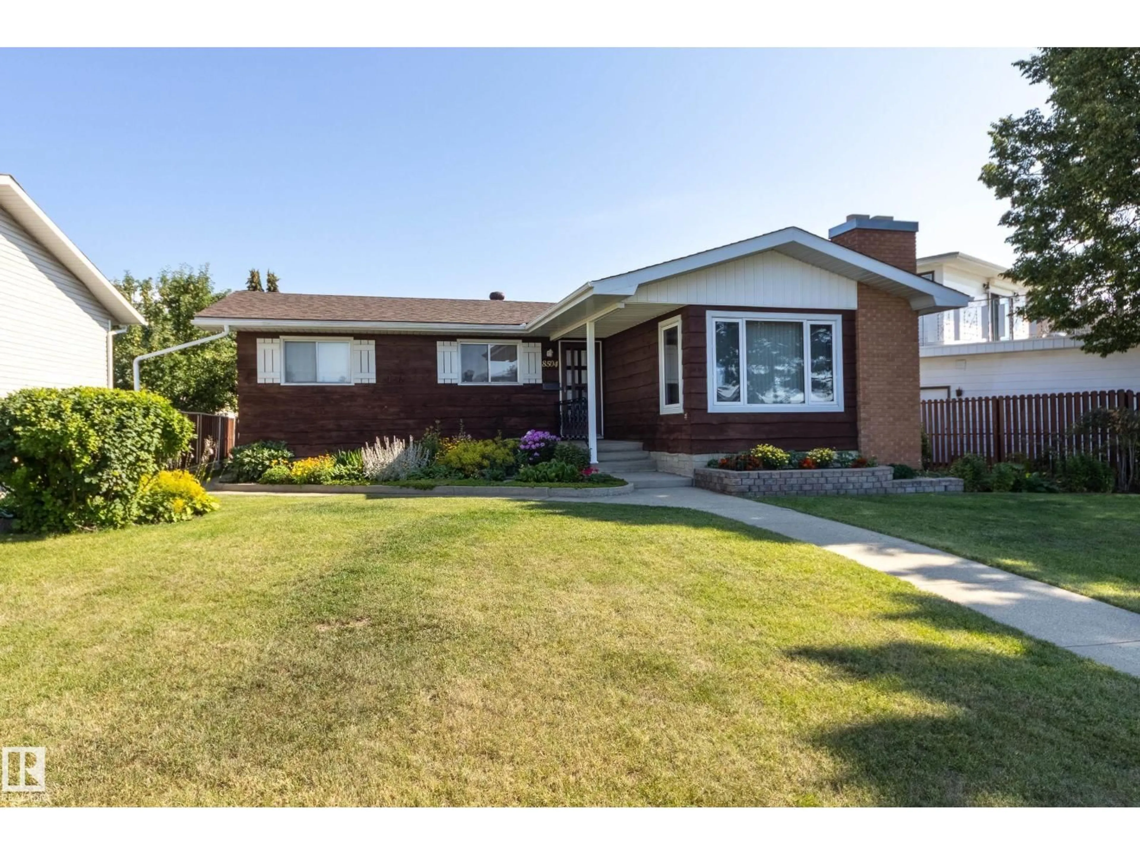 Home with brick exterior material, street for 8504 151 AV, Edmonton Alberta T5E5X1