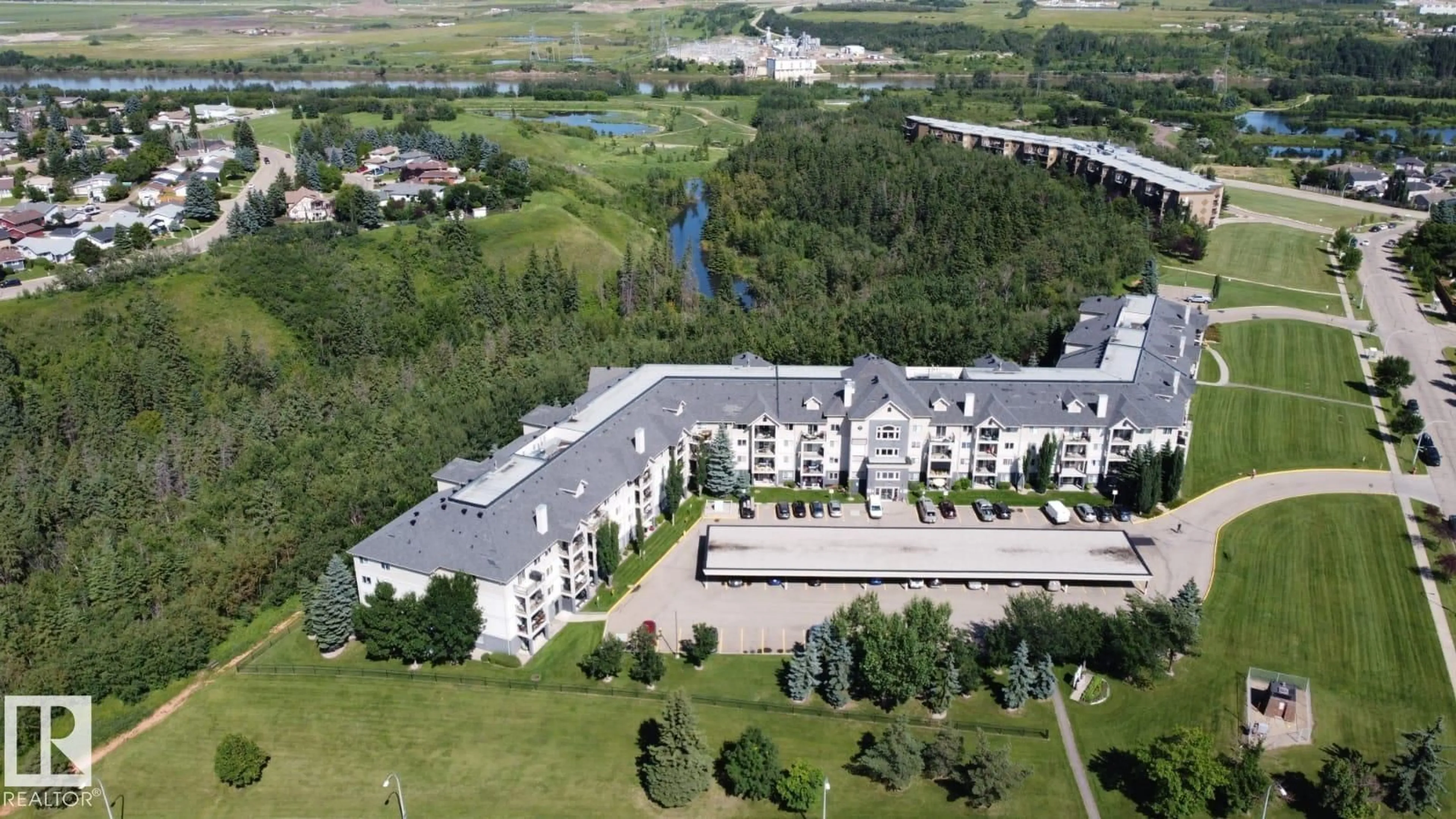 A pic from outside/outdoor area/front of a property/back of a property/a pic from drone, building for 592 - 135 HOOKE RD, Edmonton Alberta T5A5H2