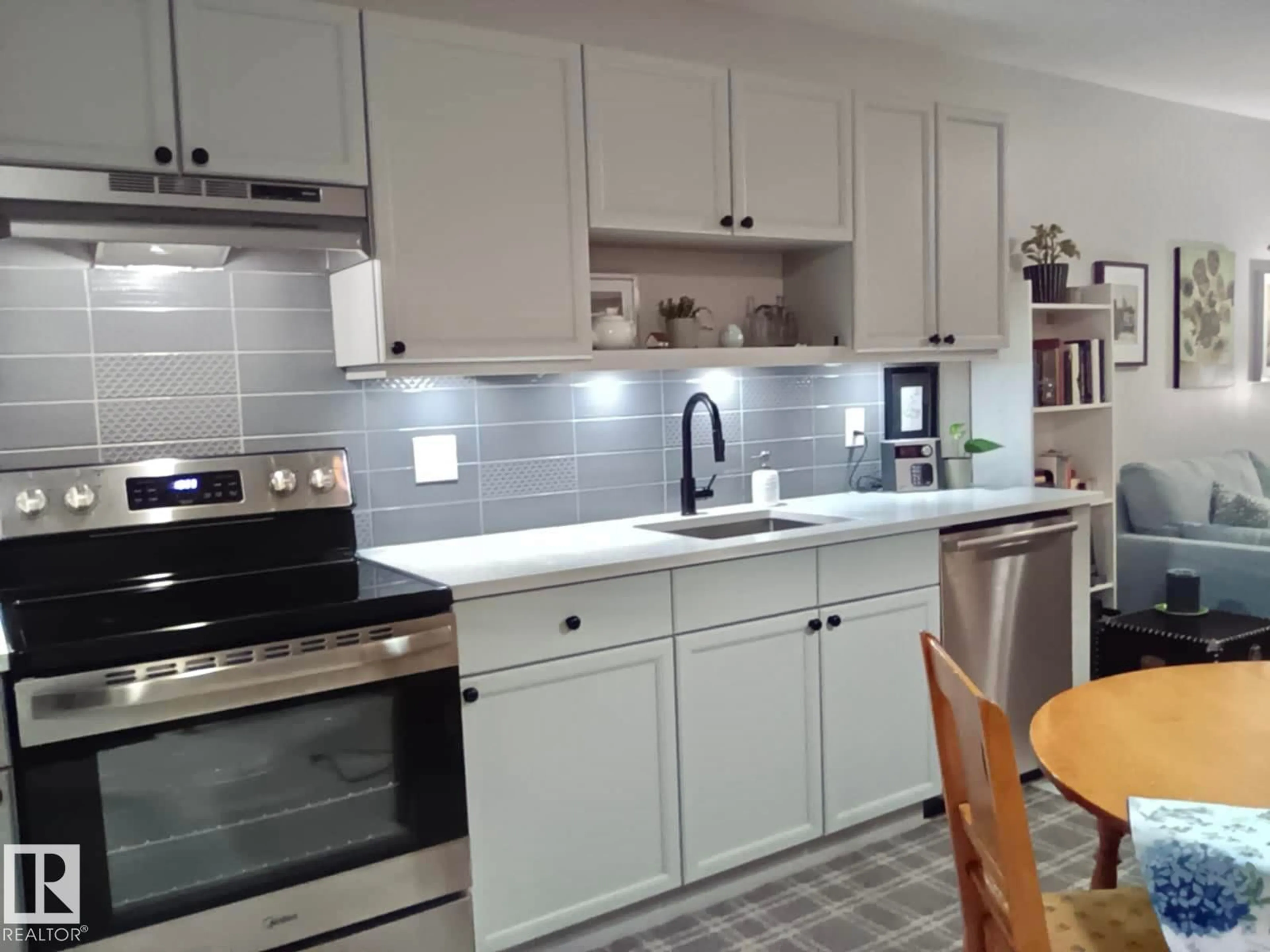 Open concept kitchen, ceramic/tile floor for 592 - 135 HOOKE RD, Edmonton Alberta T5A5H2