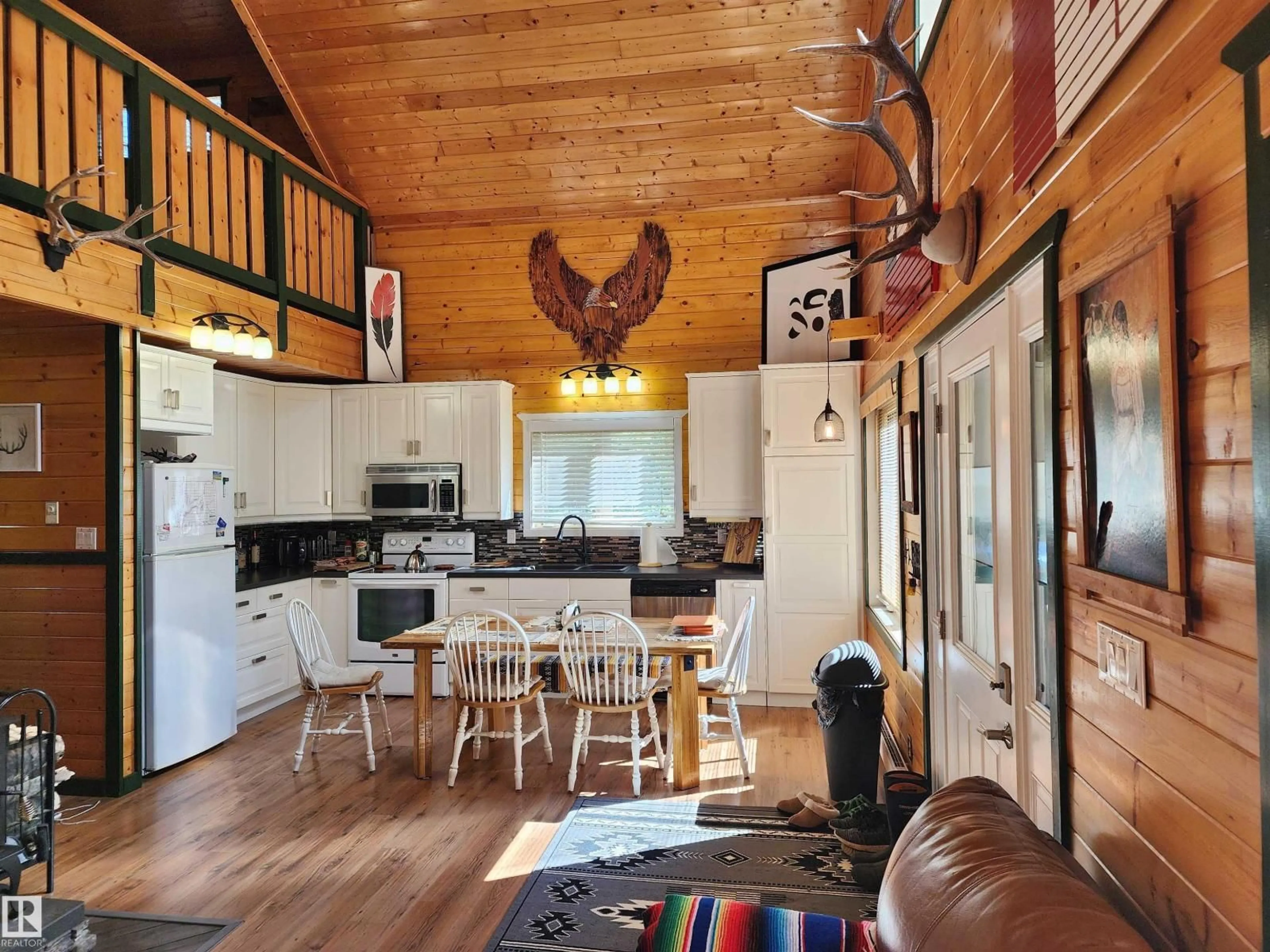 Open concept kitchen, wood/laminate floor for 410 - 55061 TWP ROAD 462, Rural Wetaskiwin County Alberta T0C0T0
