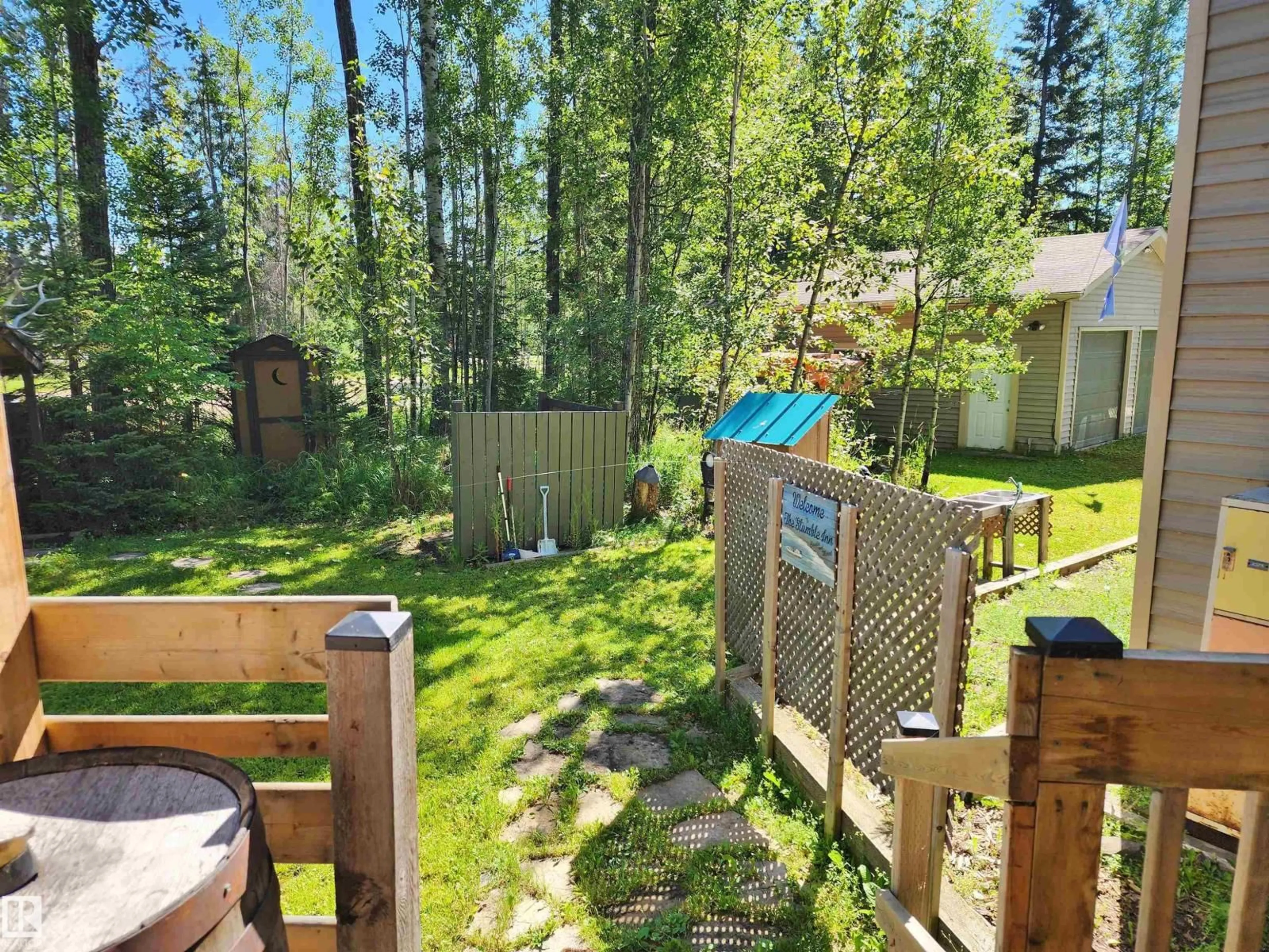 A pic from outside/outdoor area/front of a property/back of a property/a pic from drone, forest/trees view for 410 - 55061 TWP ROAD 462, Rural Wetaskiwin County Alberta T0C0T0