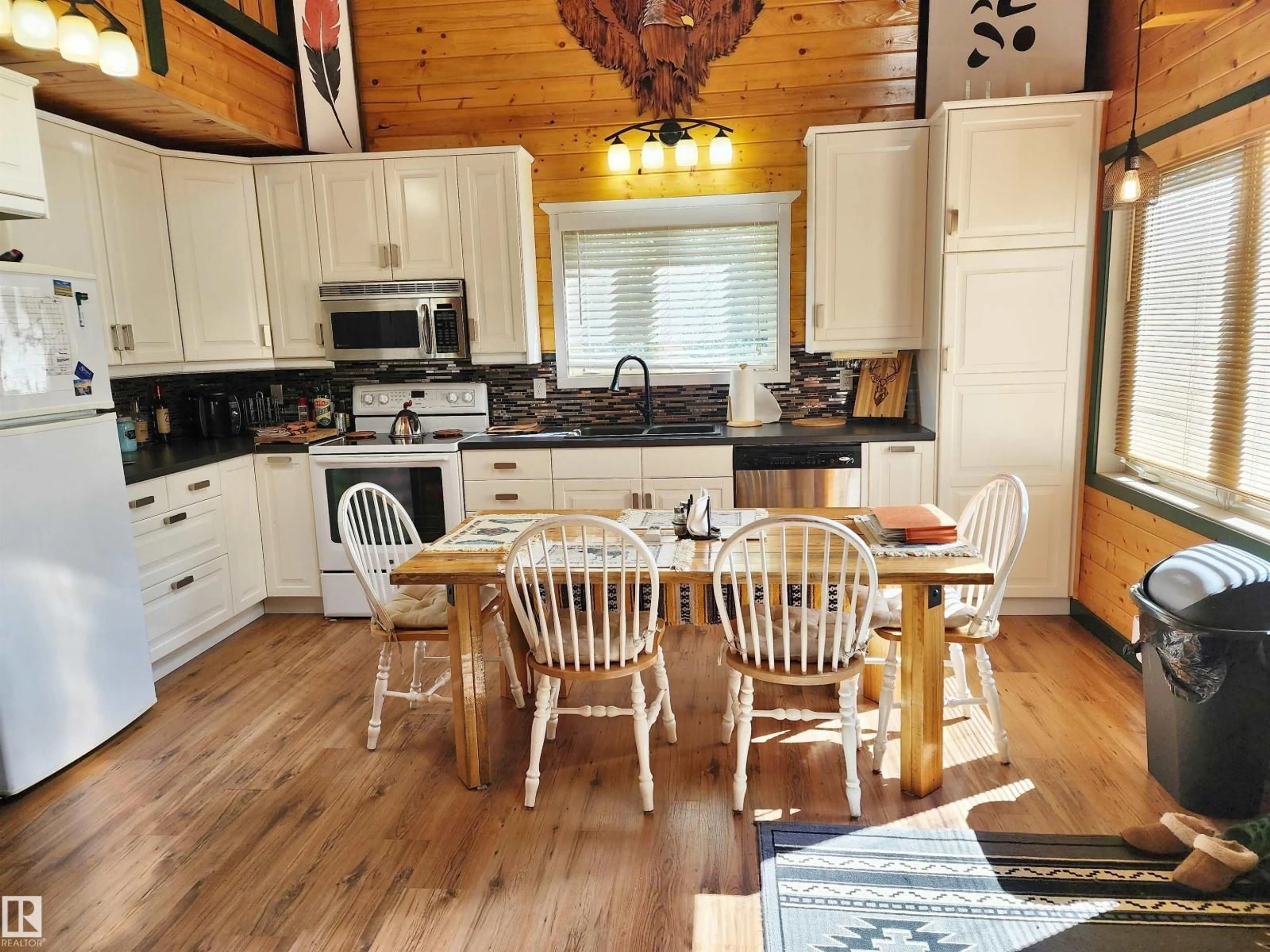 Open concept kitchen, wood/laminate floor for 410 - 55061 TWP ROAD 462, Rural Wetaskiwin County Alberta T0C0T0