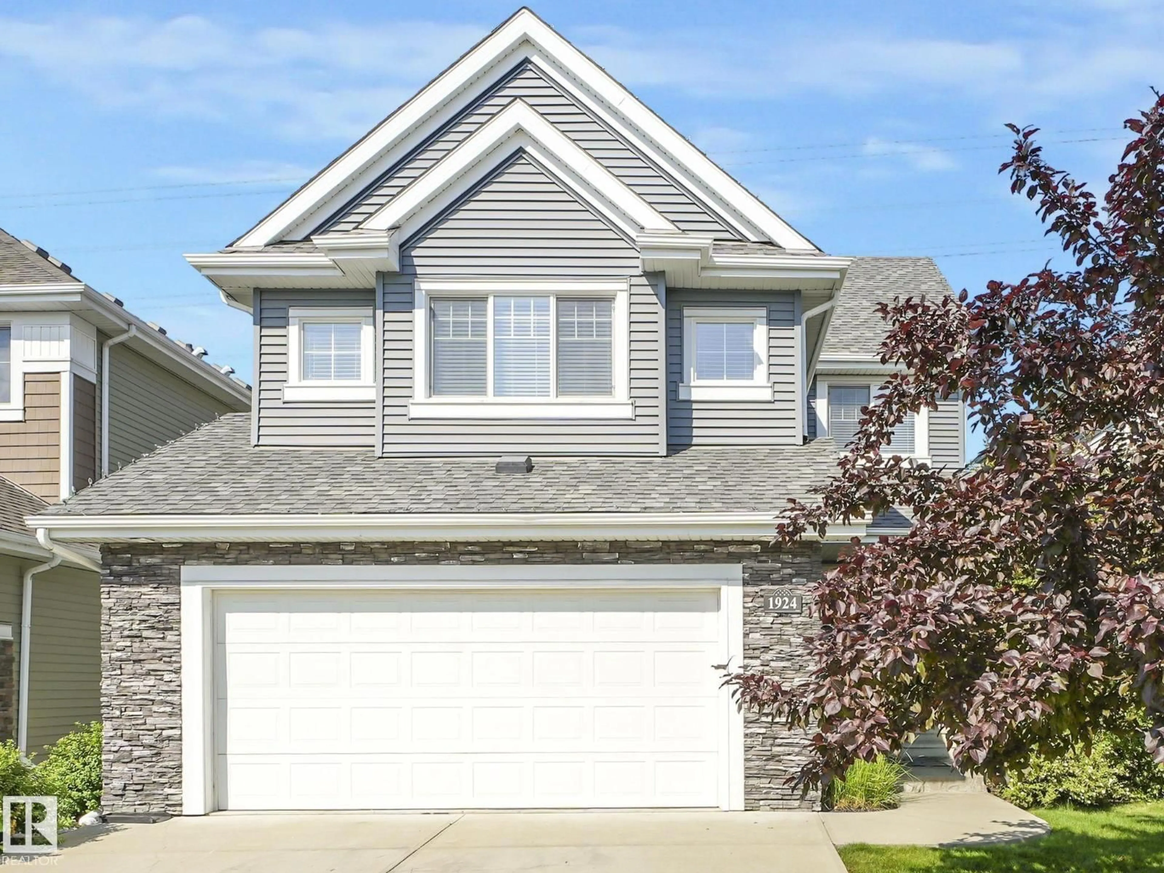 Home with vinyl exterior material, street for SW - 1924 86 ST, Edmonton Alberta T6X0R5