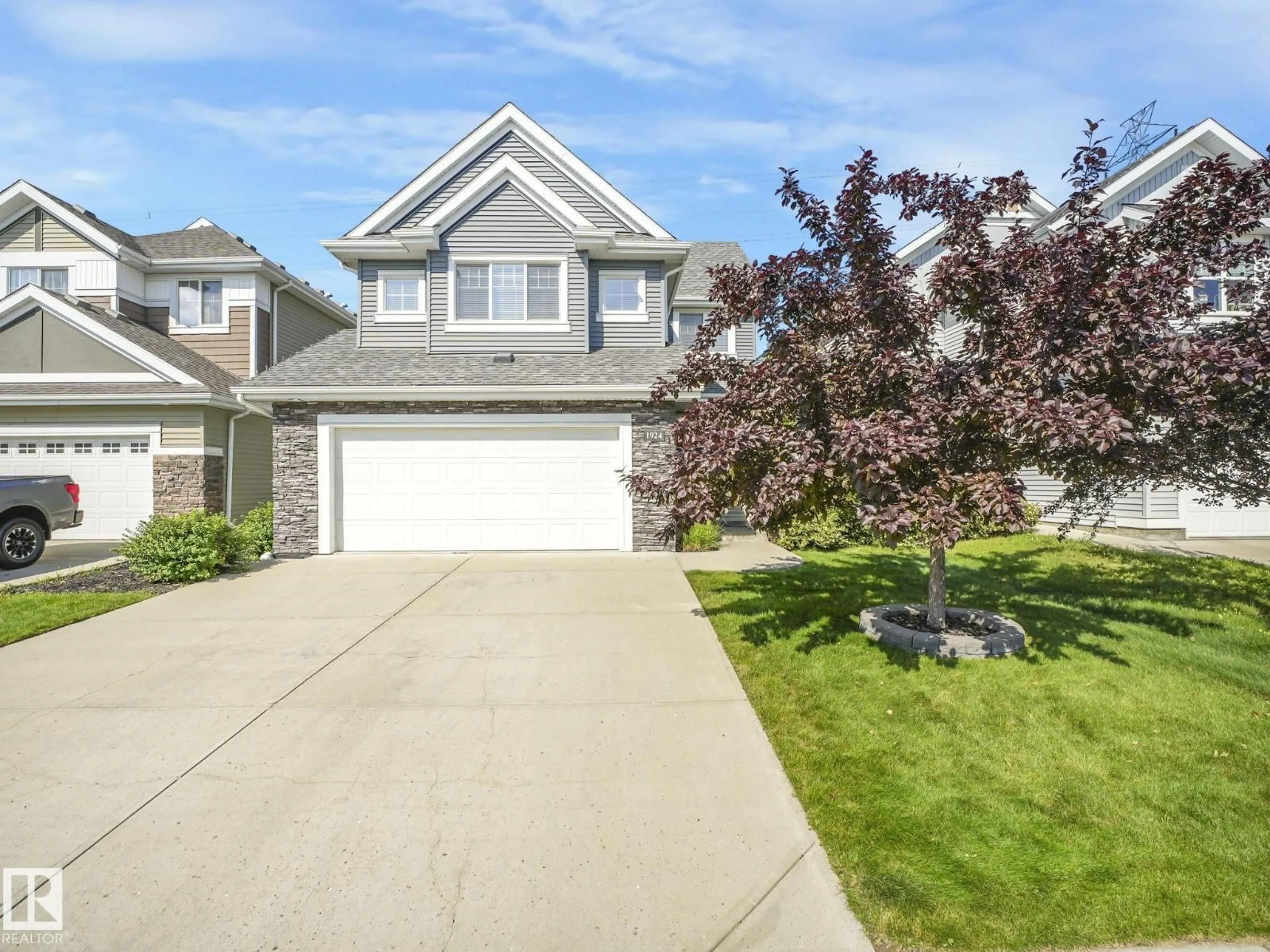 Home with vinyl exterior material, street for SW - 1924 86 ST, Edmonton Alberta T6X0R5