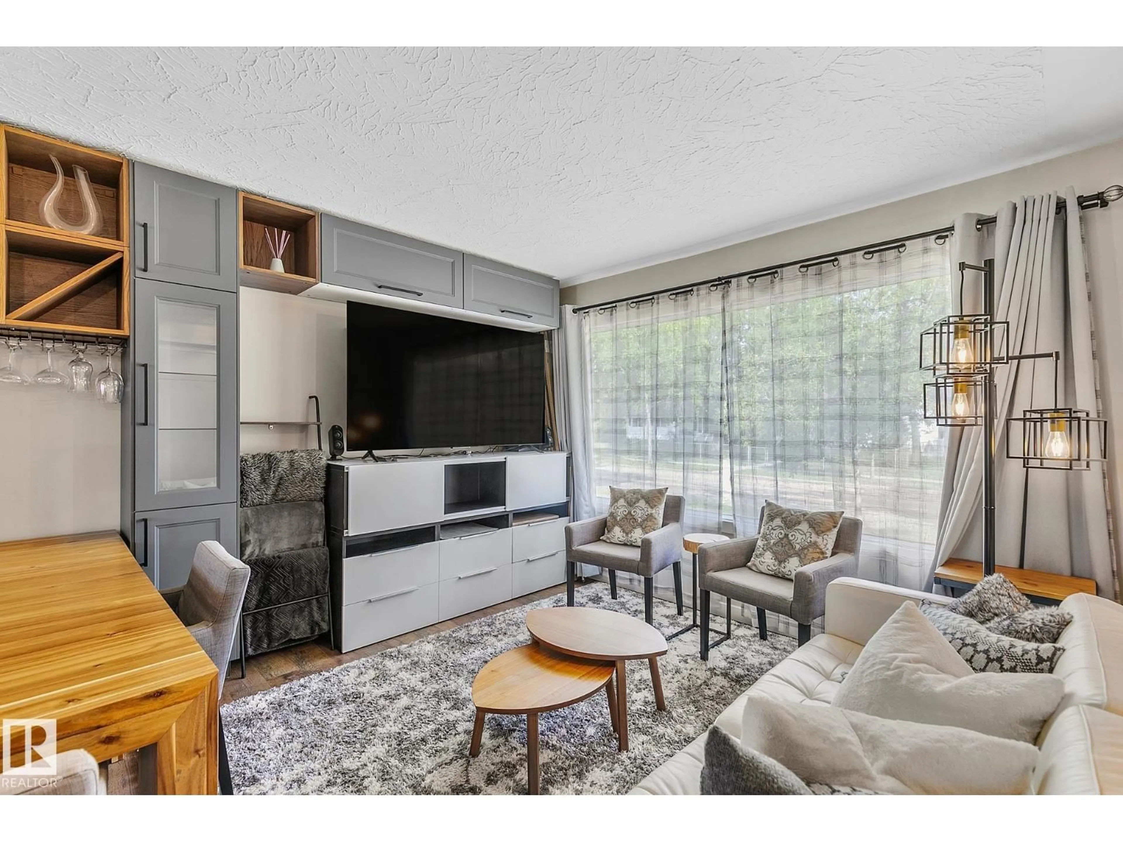 Living room with furniture, unknown for 7531 76 AV, Edmonton Alberta T6C0H3