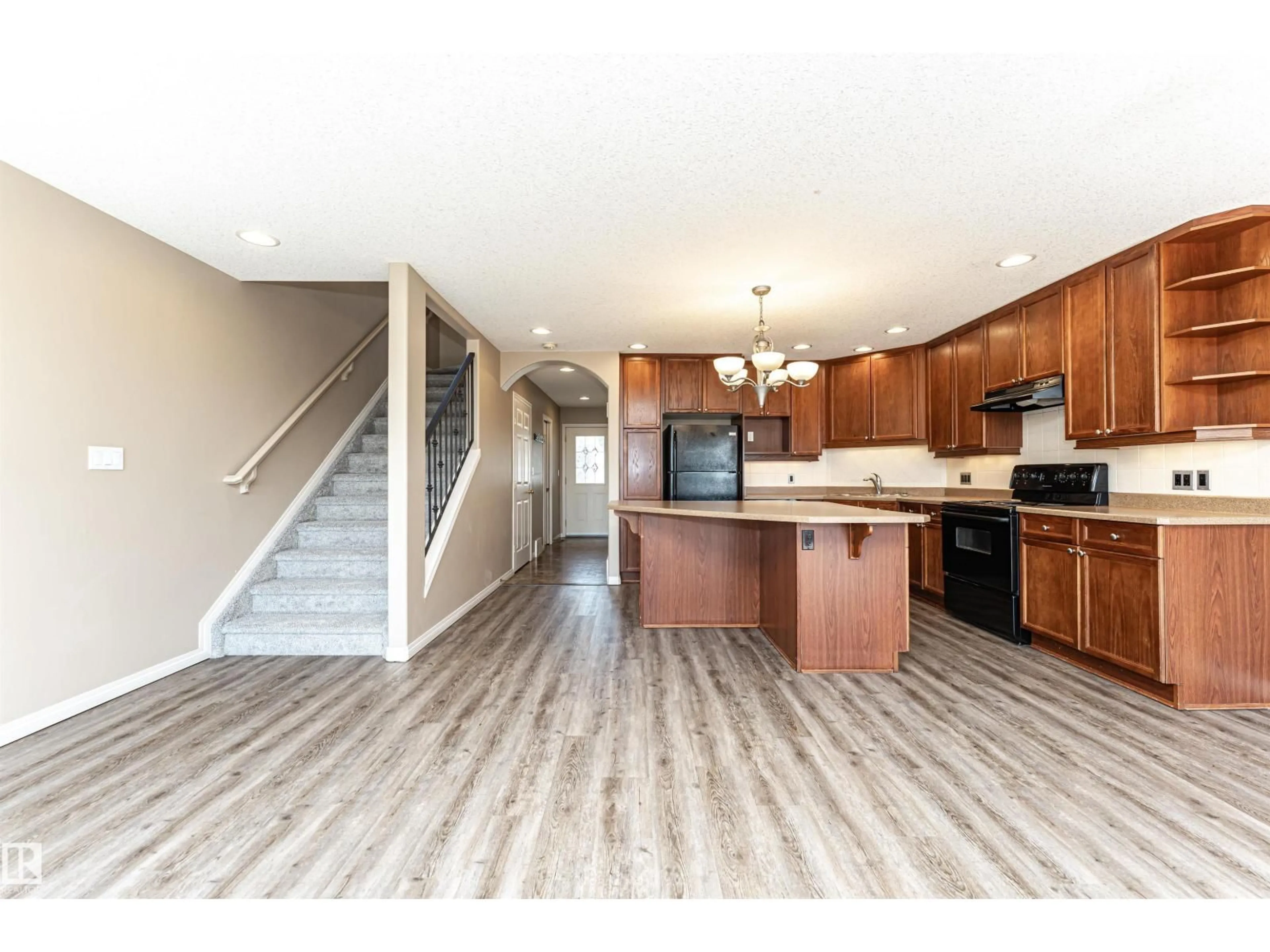 Open concept kitchen, wood/laminate floor for 9906 102 AV, Morinville Alberta T8R1V9