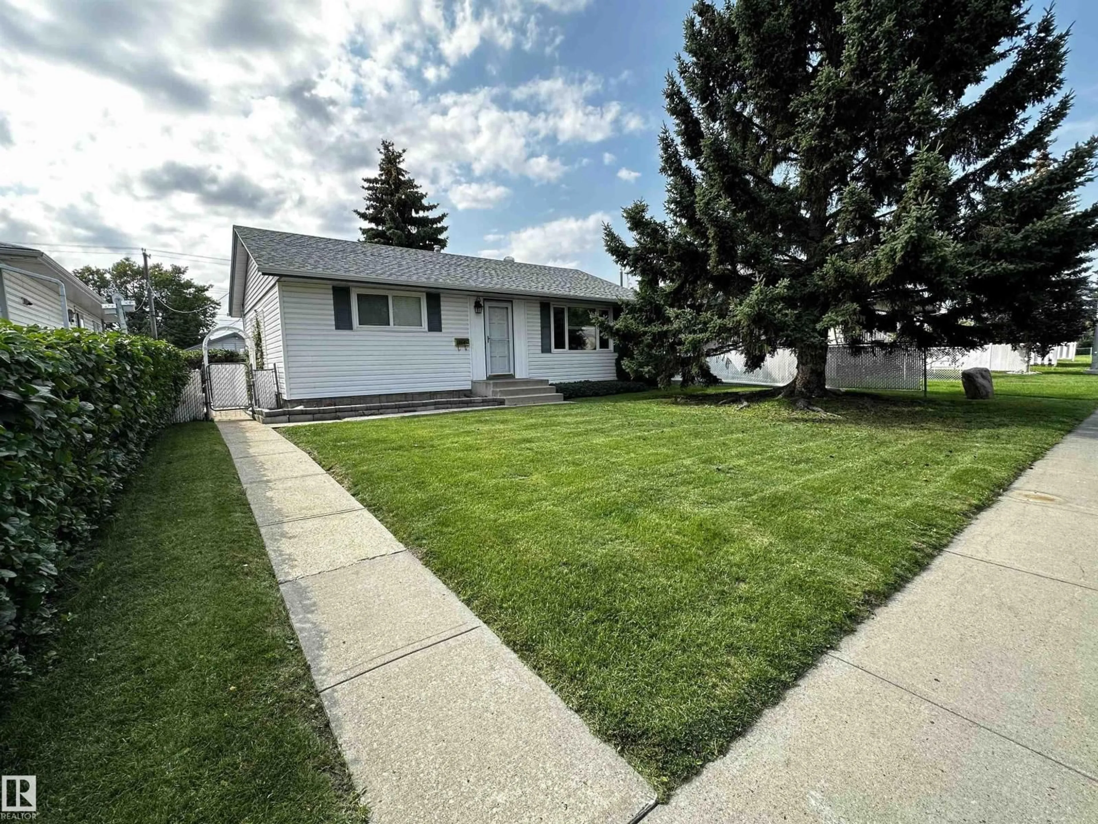 Home with vinyl exterior material, street for NW - 10604 153 ST, Edmonton Alberta T5P2C5