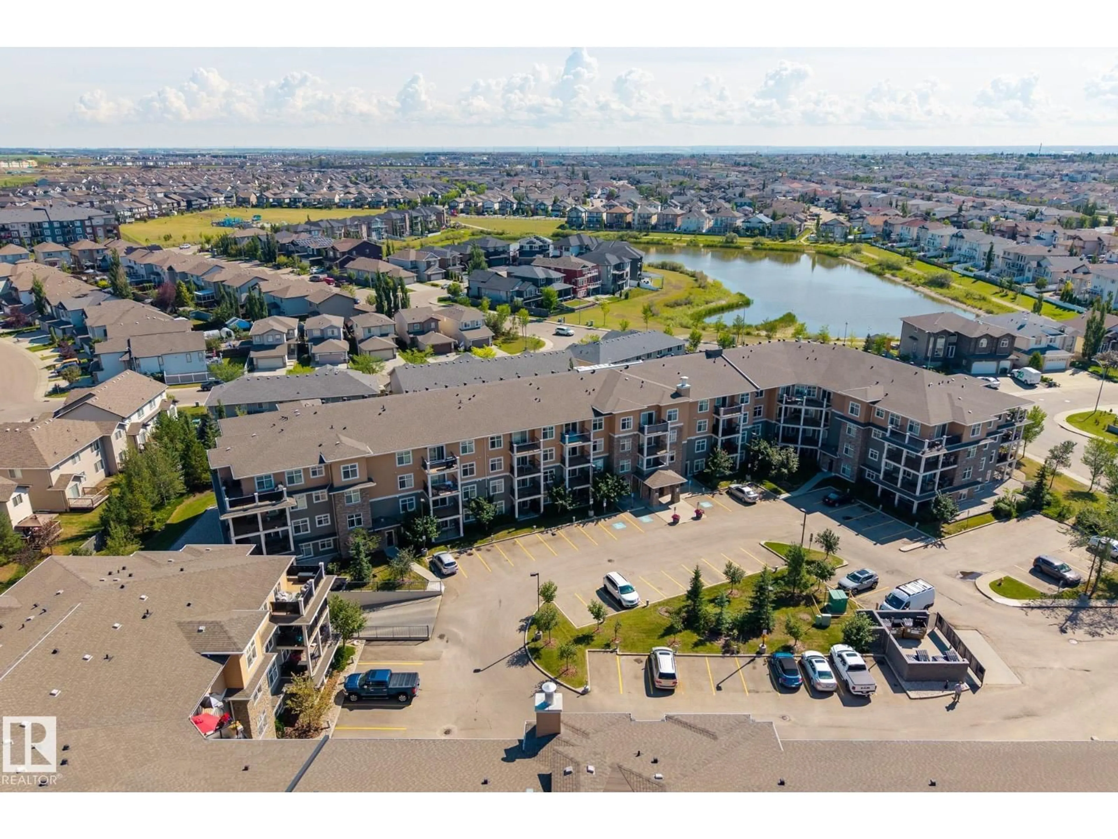 A pic from outside/outdoor area/front of a property/back of a property/a pic from drone, water/lake/river/ocean view for 310 - 6070 SCHONSEE WY, Edmonton Alberta T5Z0G8