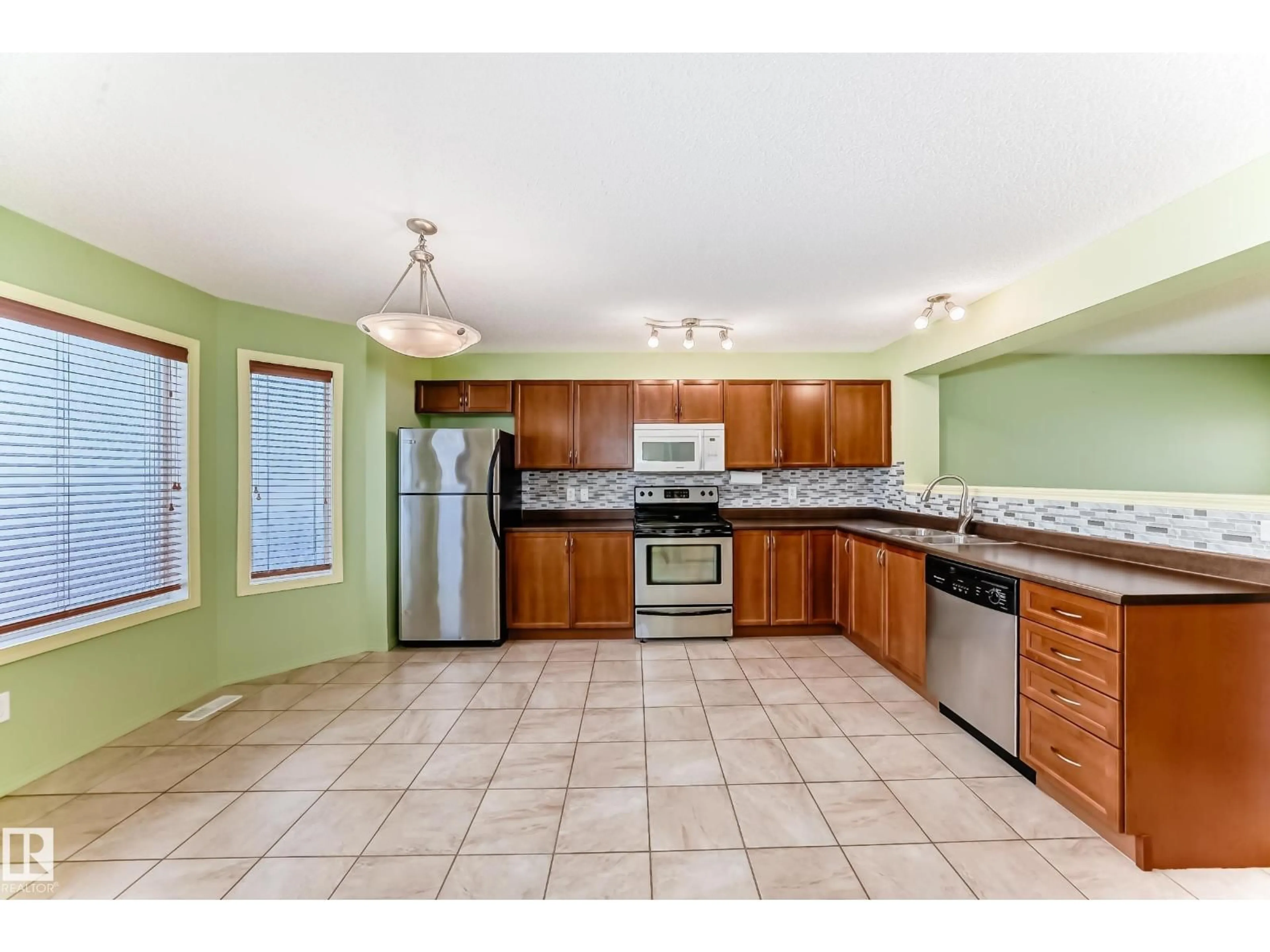Open concept kitchen, ceramic/tile floor for 7108 16 AV, Edmonton Alberta T6X0H3