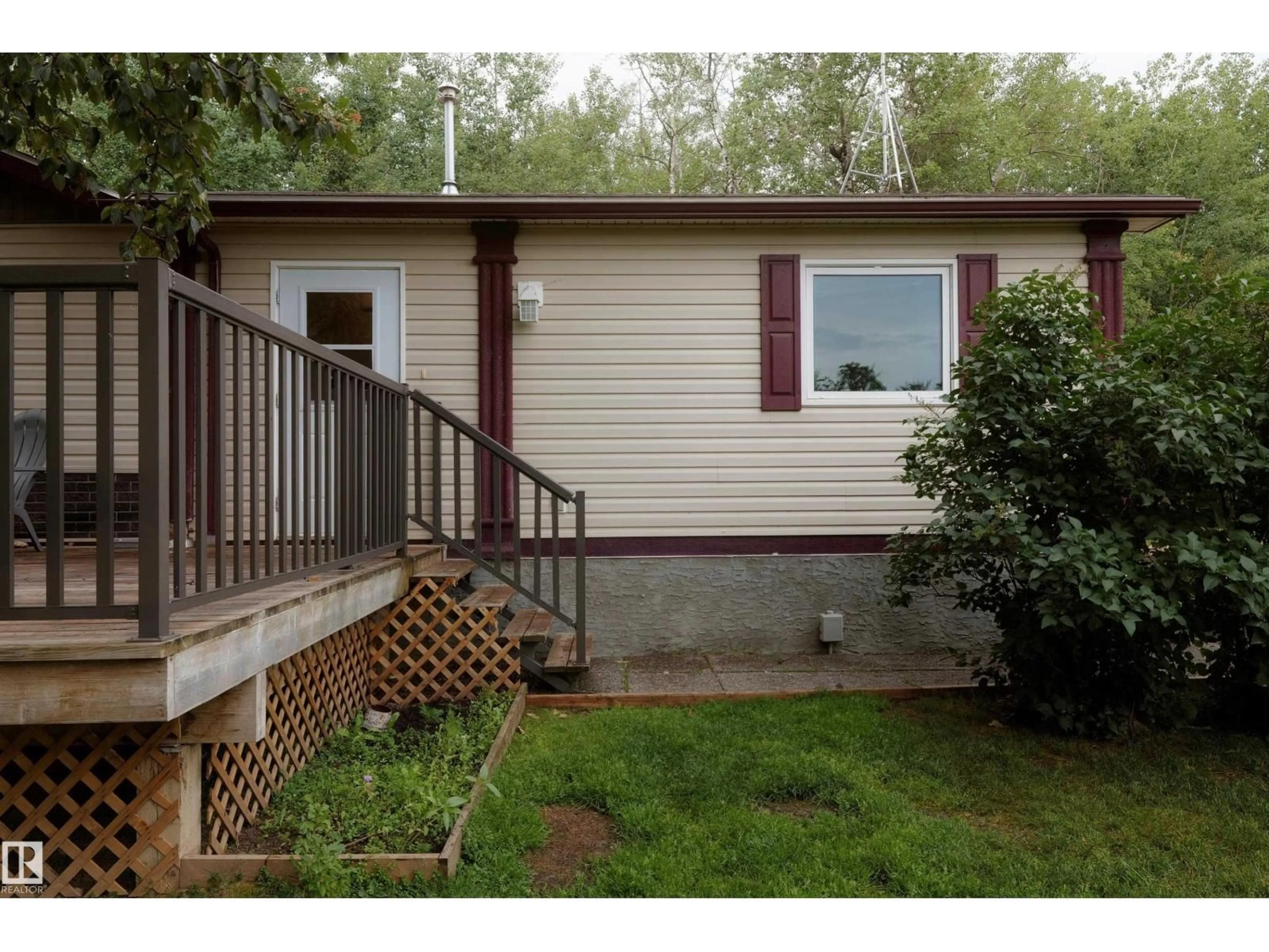 Home with vinyl exterior material, street for 60004 RGE RD 64, Rural Barrhead County Alberta T7N1N3