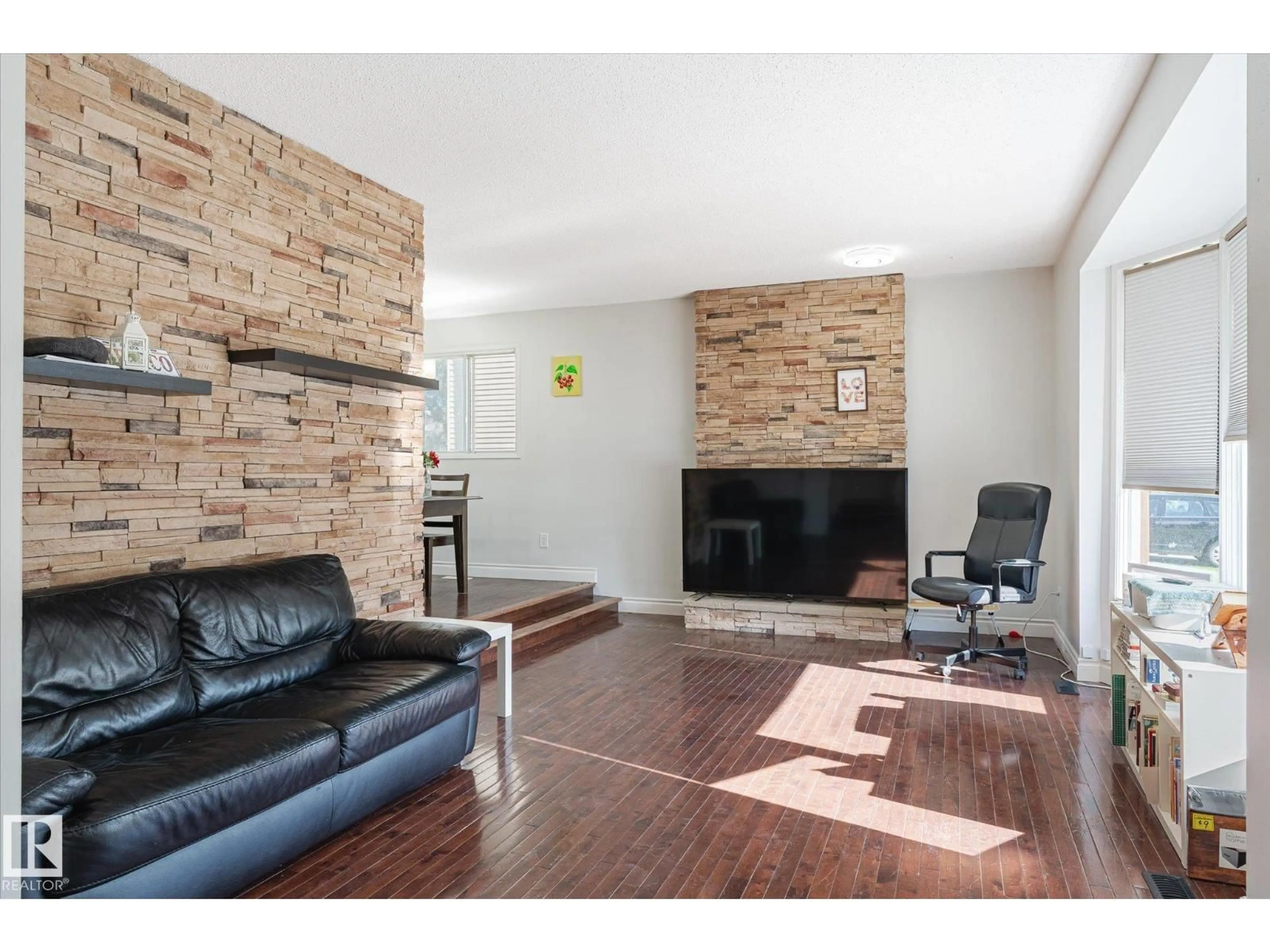Living room with furniture, wood/laminate floor for NW - 2520 116 ST, Edmonton Alberta T6J3S2