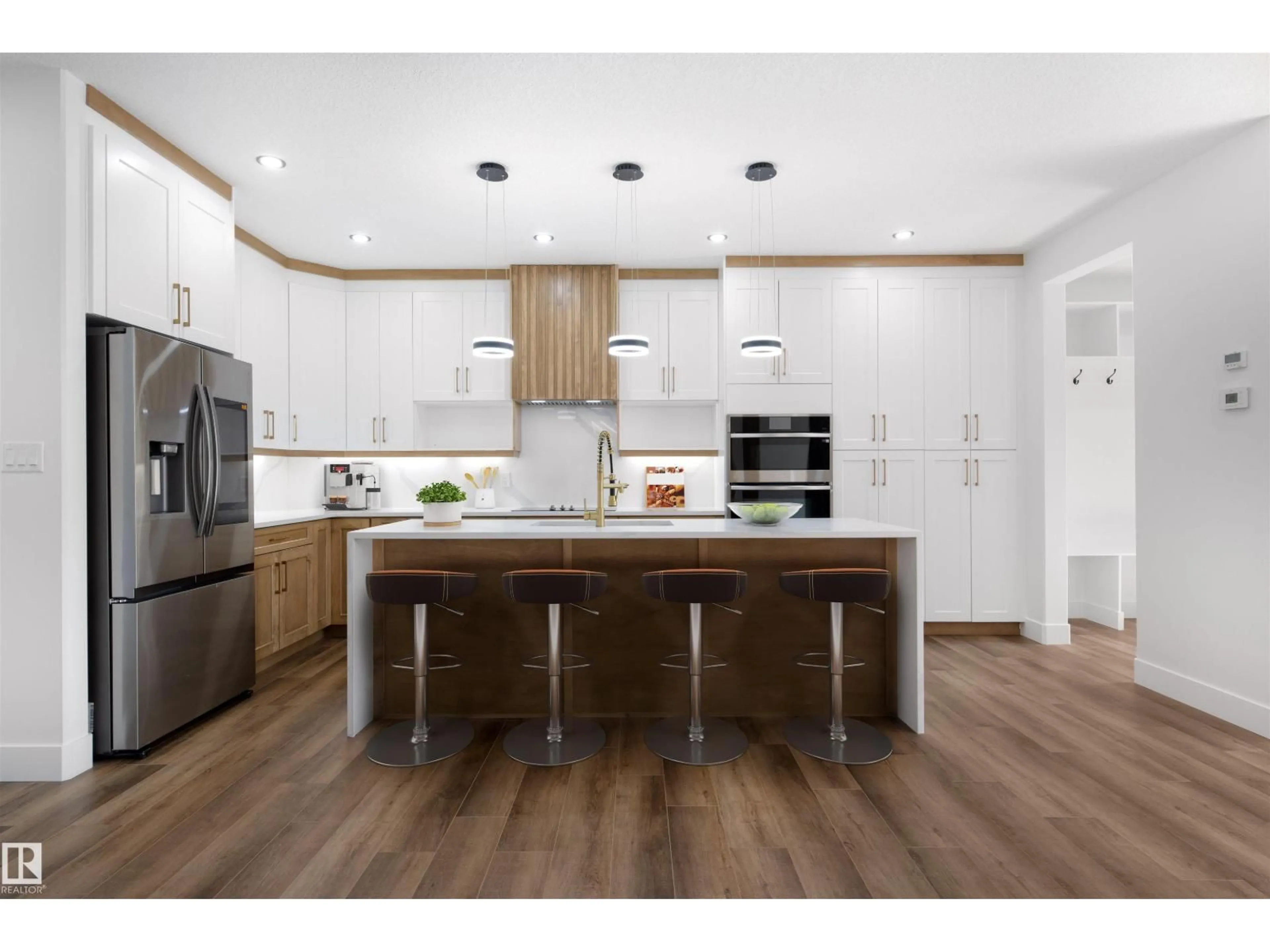 Open concept kitchen, wood/laminate floor for 10725 65 ST, Edmonton Alberta T6A2P3