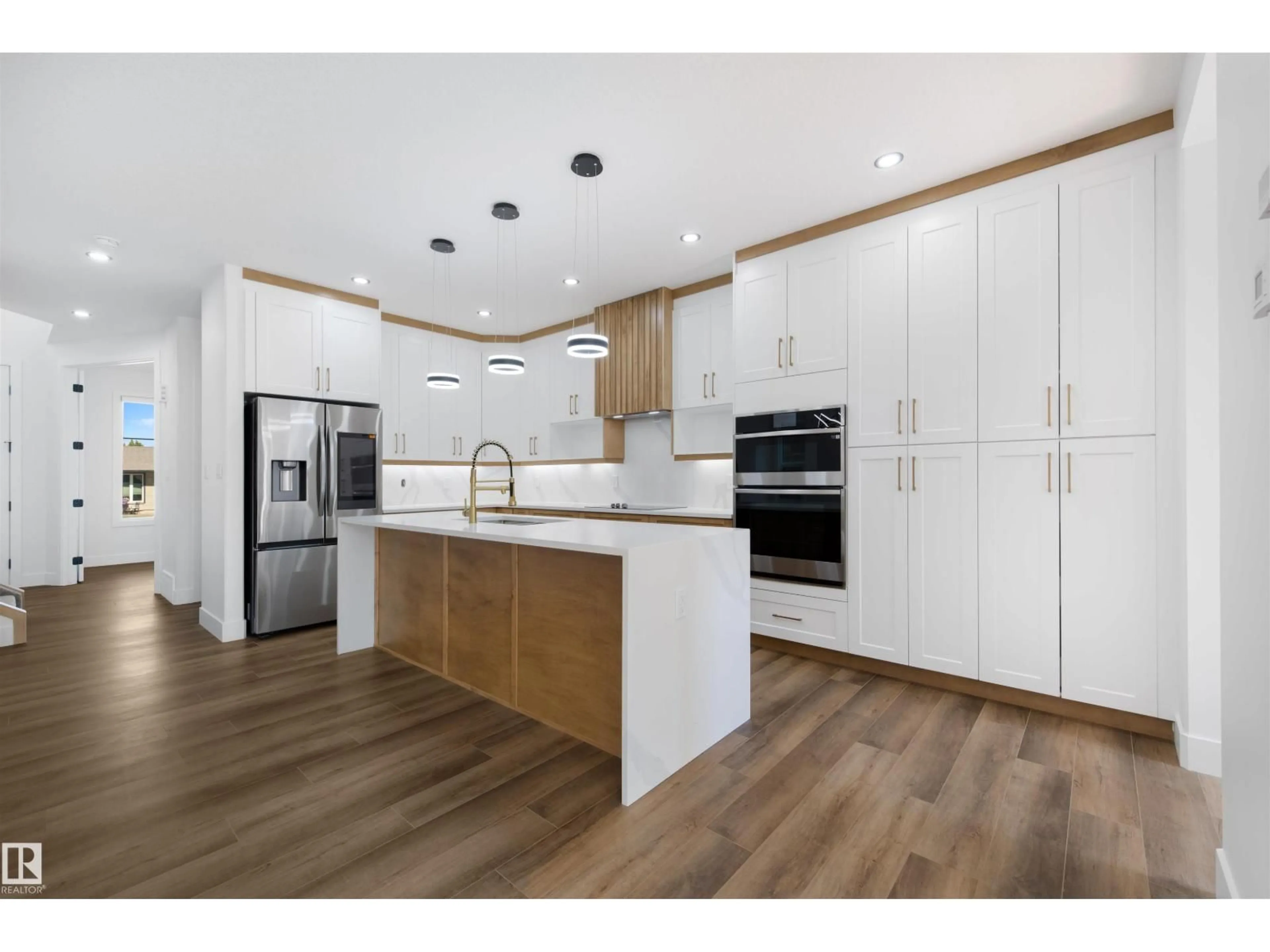 Open concept kitchen, wood/laminate floor for 10725 65 ST, Edmonton Alberta T6A2P3