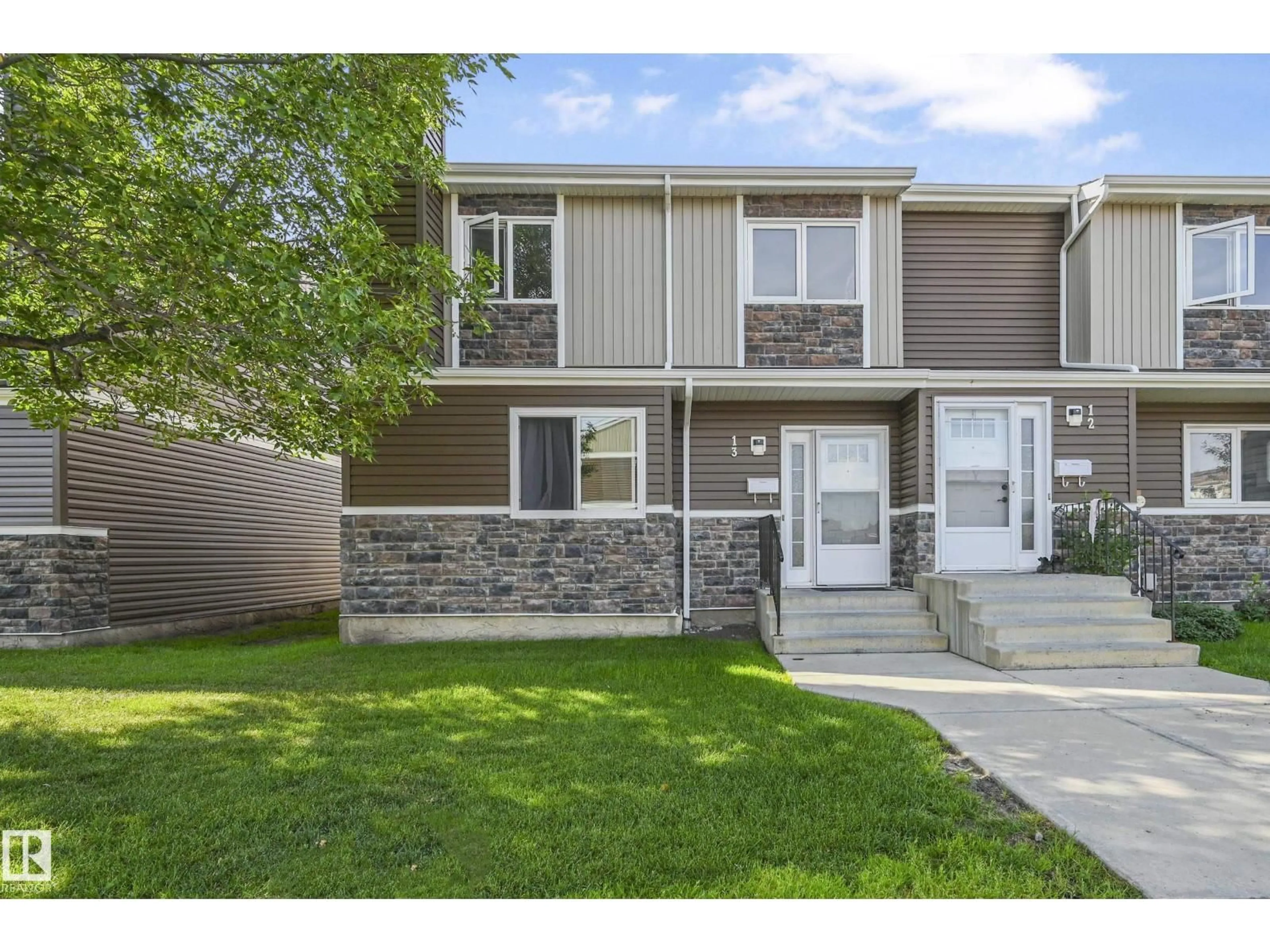 Home with vinyl exterior material, street for 13 - 3115 119 ST, Edmonton Alberta T6J5N5