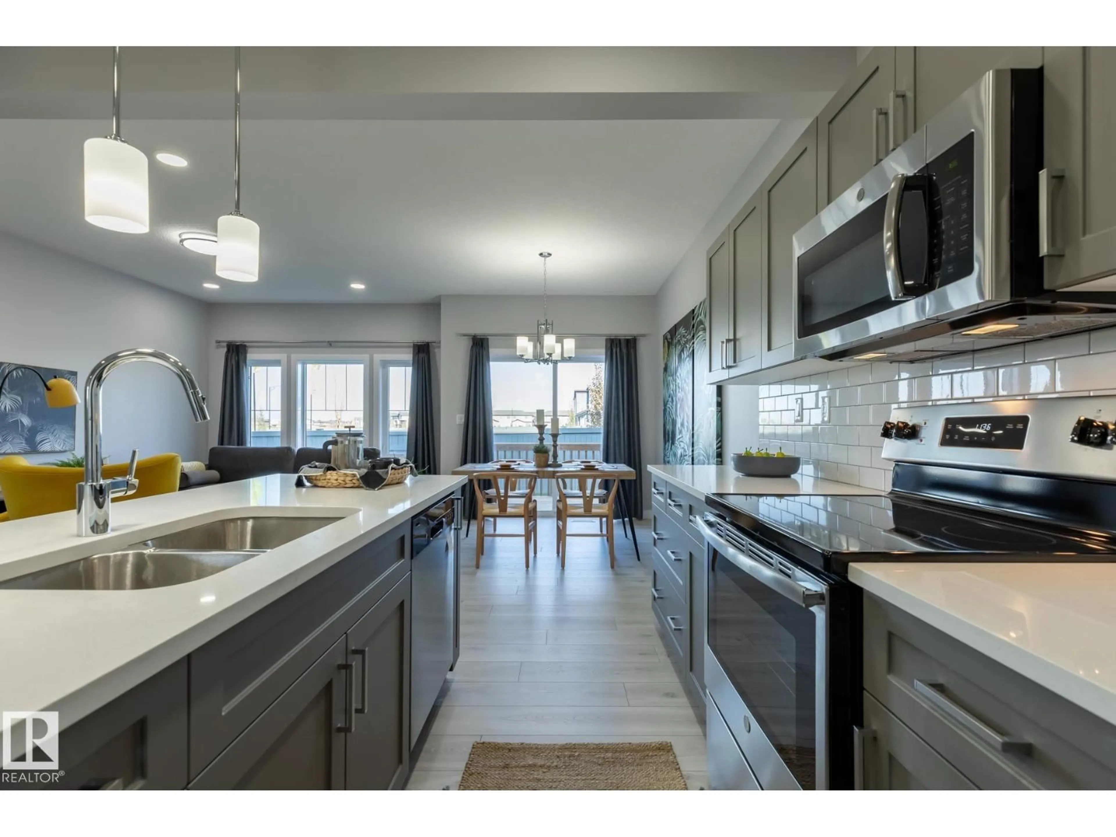 Open concept kitchen, ceramic/tile floor for 10716 99 ST, Morinville Alberta T8R2R8