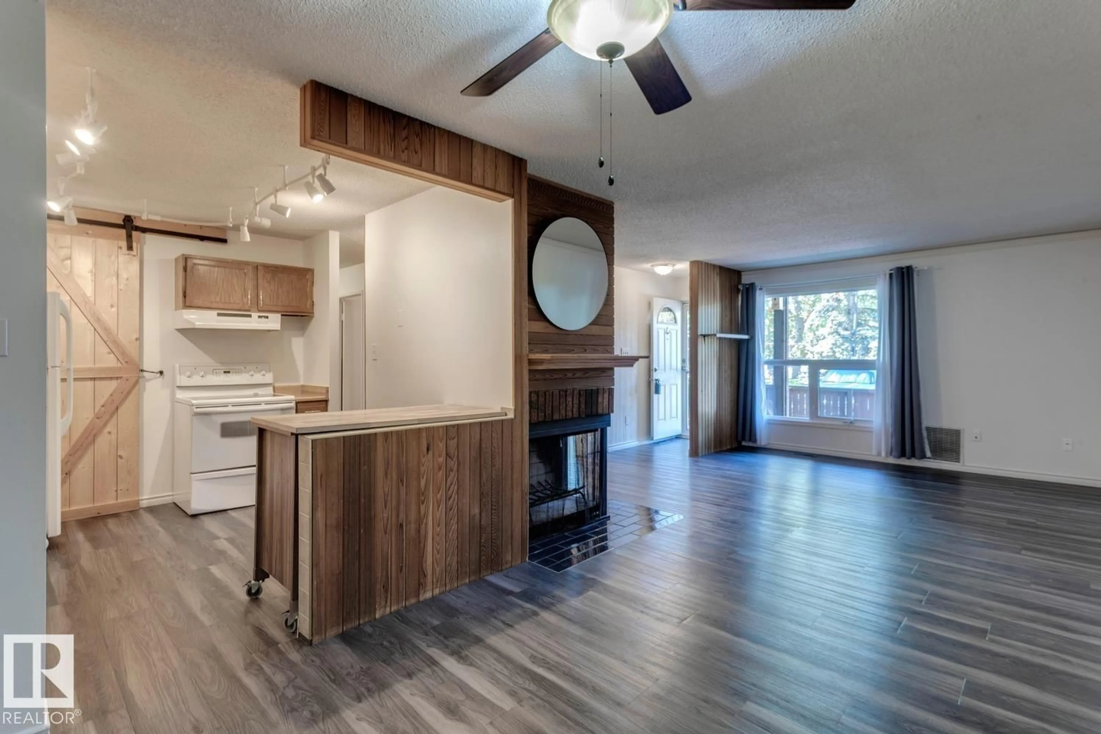 Open concept kitchen, wood/laminate floor for 206 SURREY GARDENS GD, Edmonton Alberta T5T1Z3
