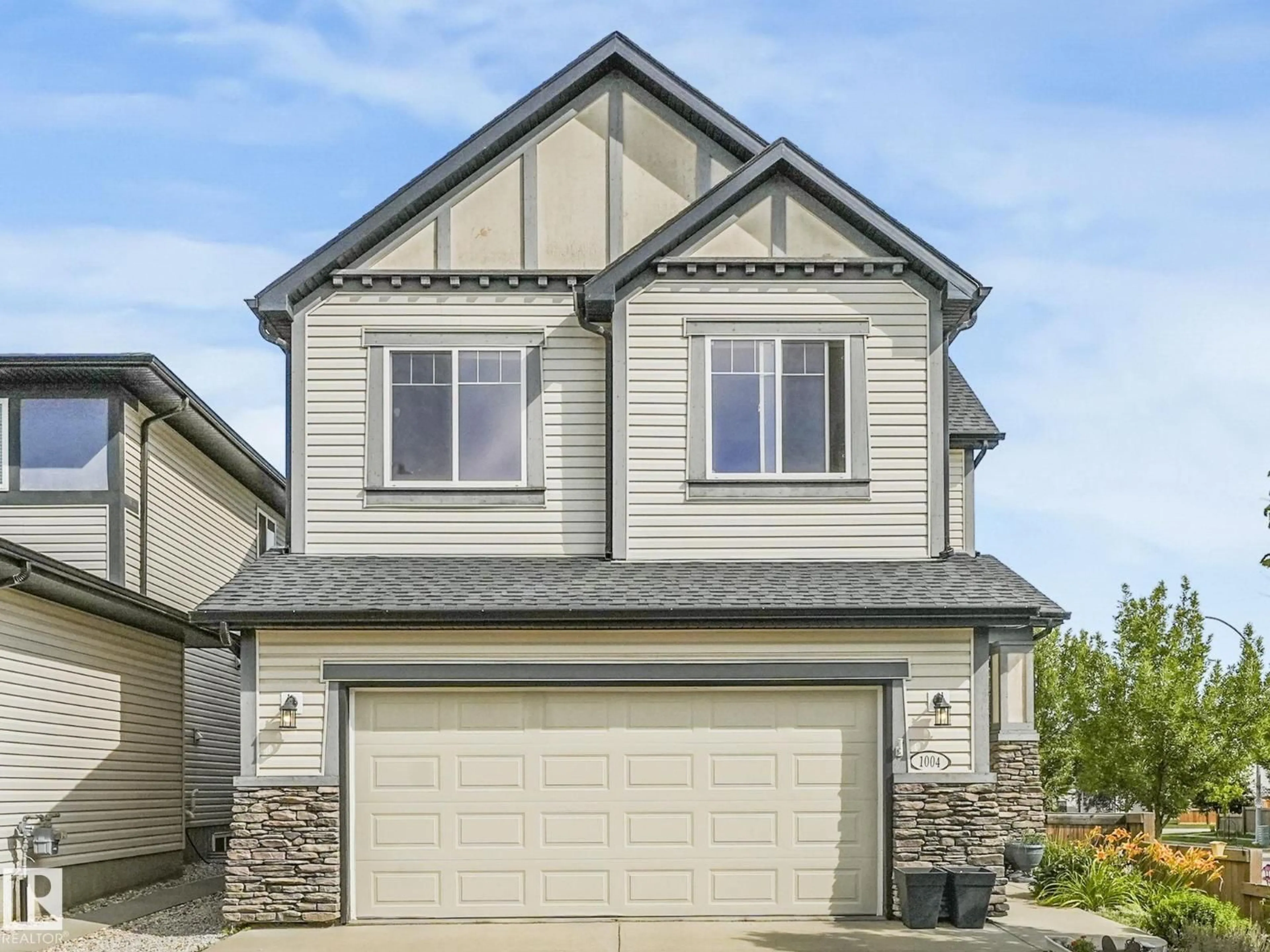 Home with vinyl exterior material, street for NW - 1004 SECORD PM, Edmonton Alberta T5T4A4