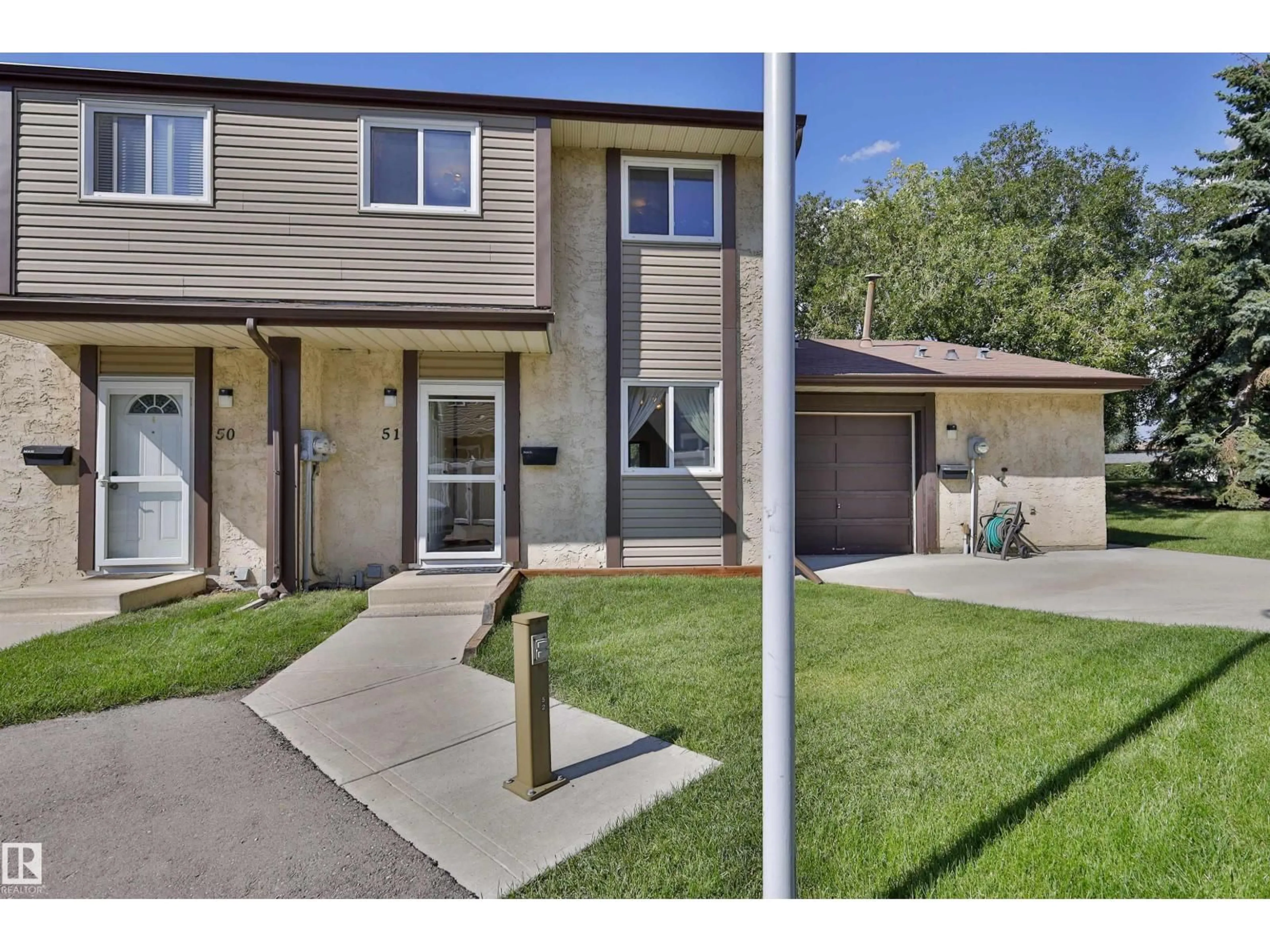 Home with vinyl exterior material, street for #51 - 10453 20 AV, Edmonton Alberta T6J5H1
