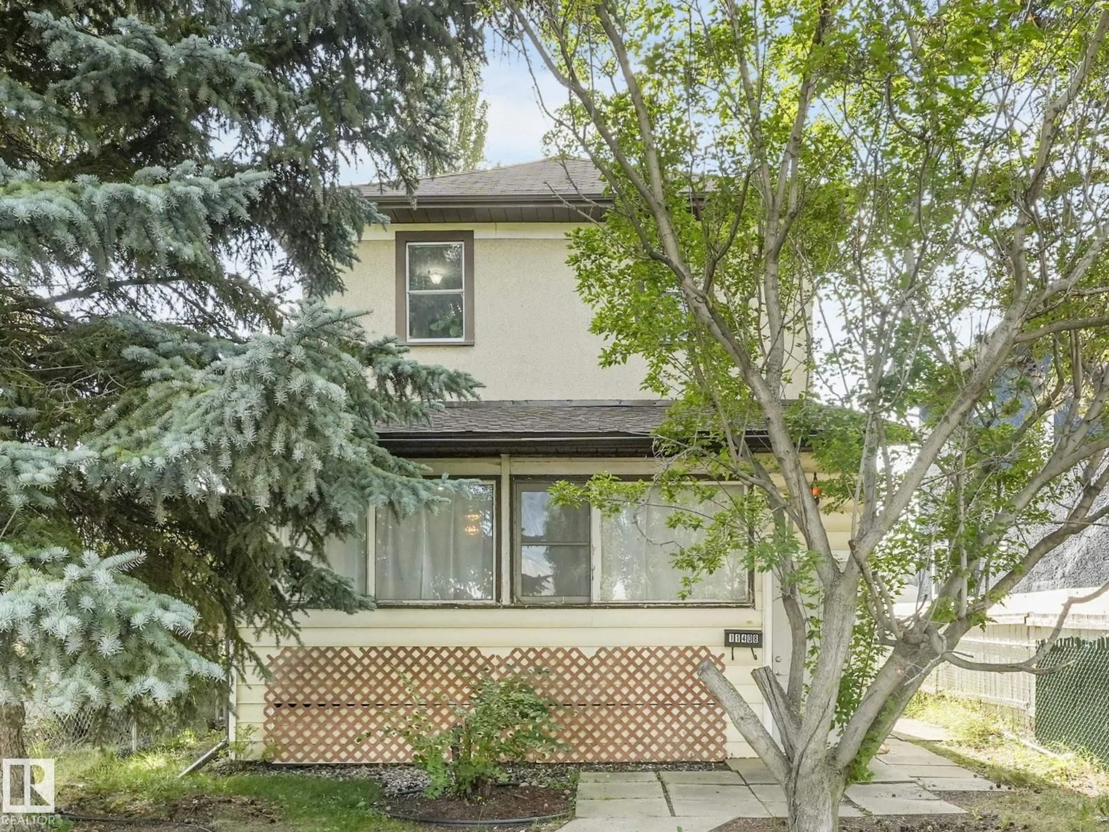 Home with vinyl exterior material, street for 11408 81 ST, Edmonton Alberta T5B2R6