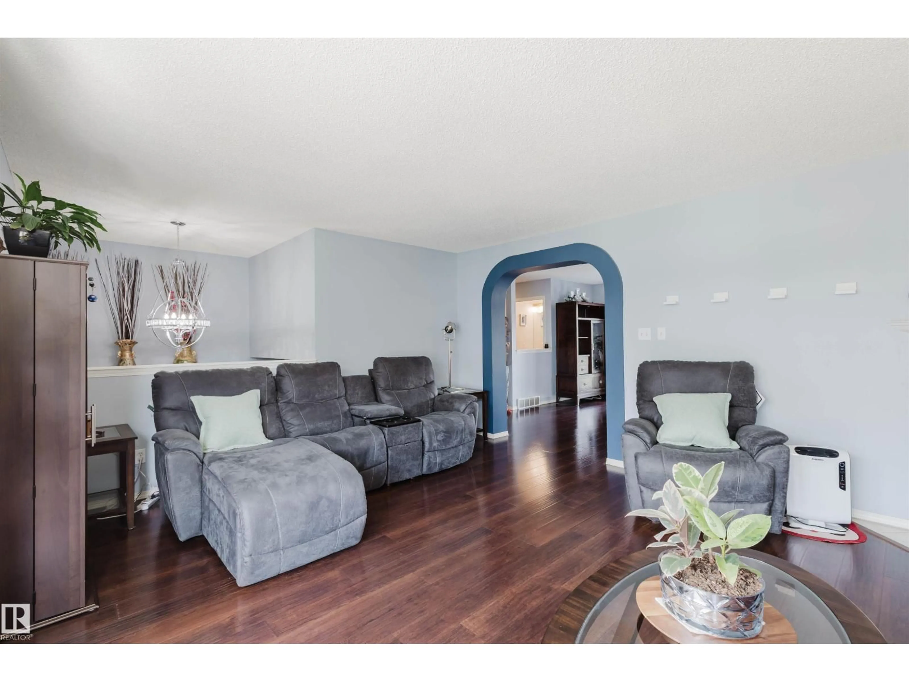 Living room with furniture, wood/laminate floor for #108 - 1670 JAMHA RD, Edmonton Alberta T6L7B3