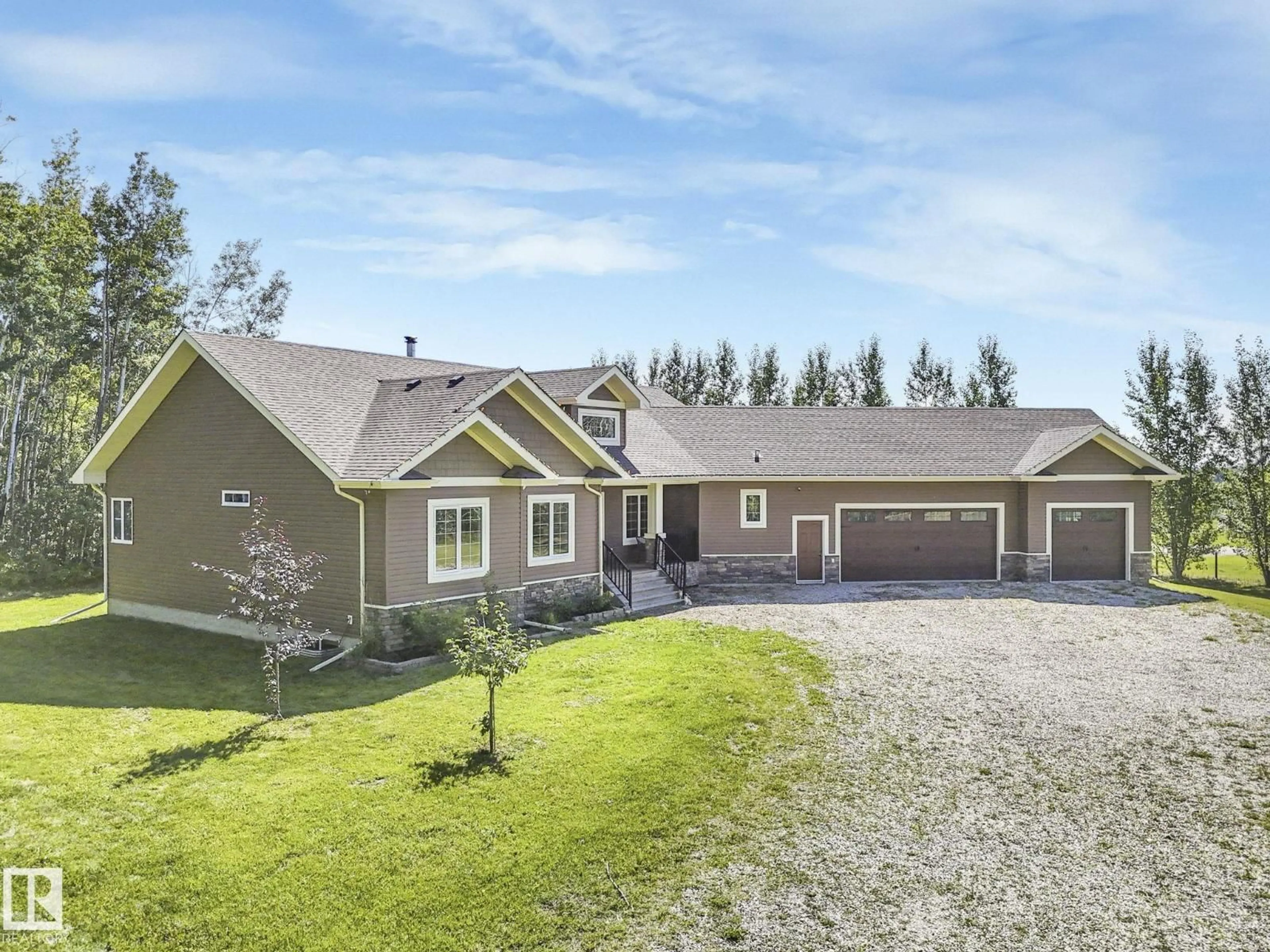 A pic from outside/outdoor area/front of a property/back of a property/a pic from drone, street for 31 - 1319 TWP ROAD 510, Rural Parkland County Alberta T7Y2N2