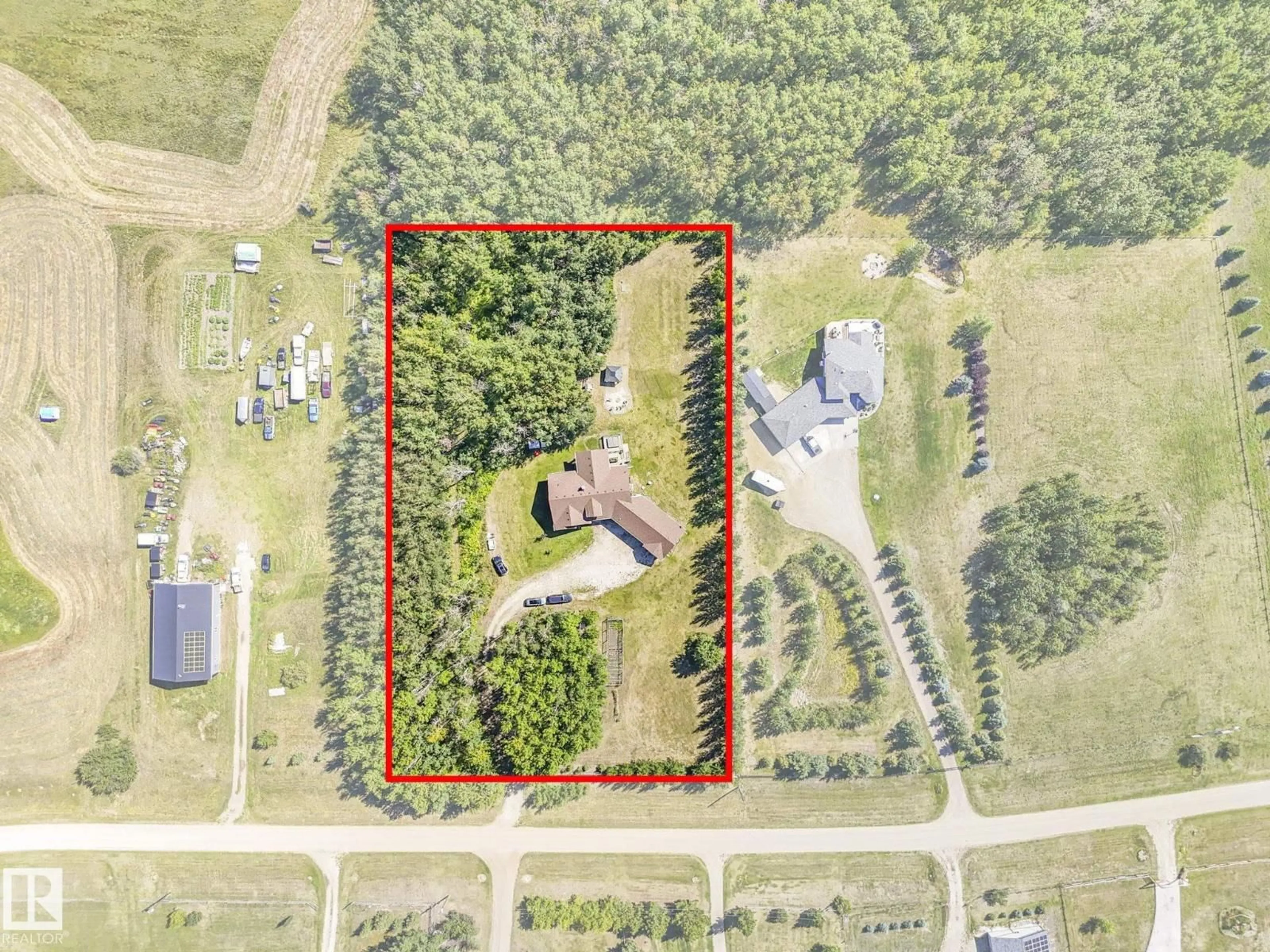 A pic from outside/outdoor area/front of a property/back of a property/a pic from drone, building for 31 - 1319 TWP ROAD 510, Rural Parkland County Alberta T7Y2N2