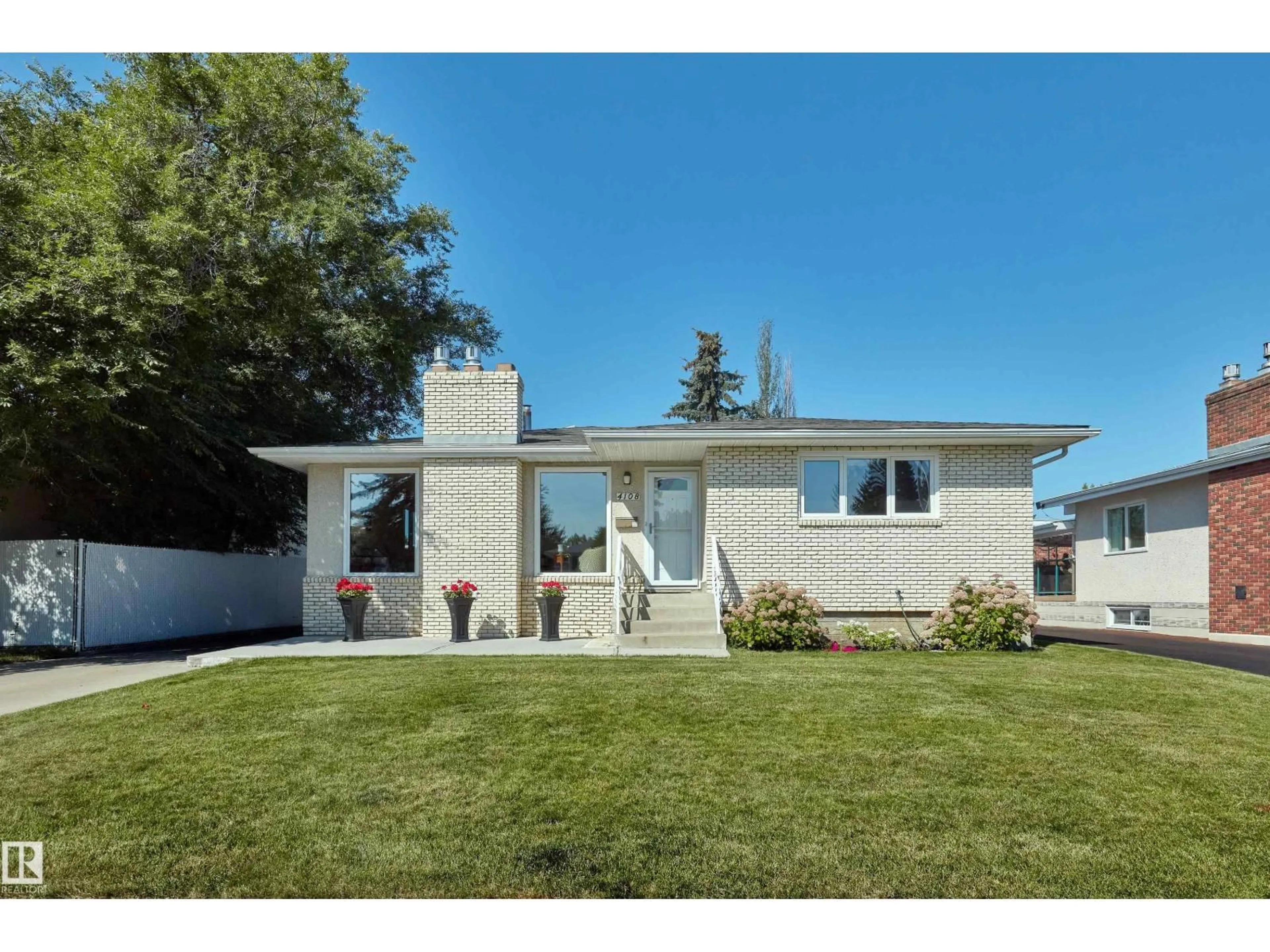 Home with vinyl exterior material, street for NW - 4108 108 ST, Edmonton Alberta T6J2R6
