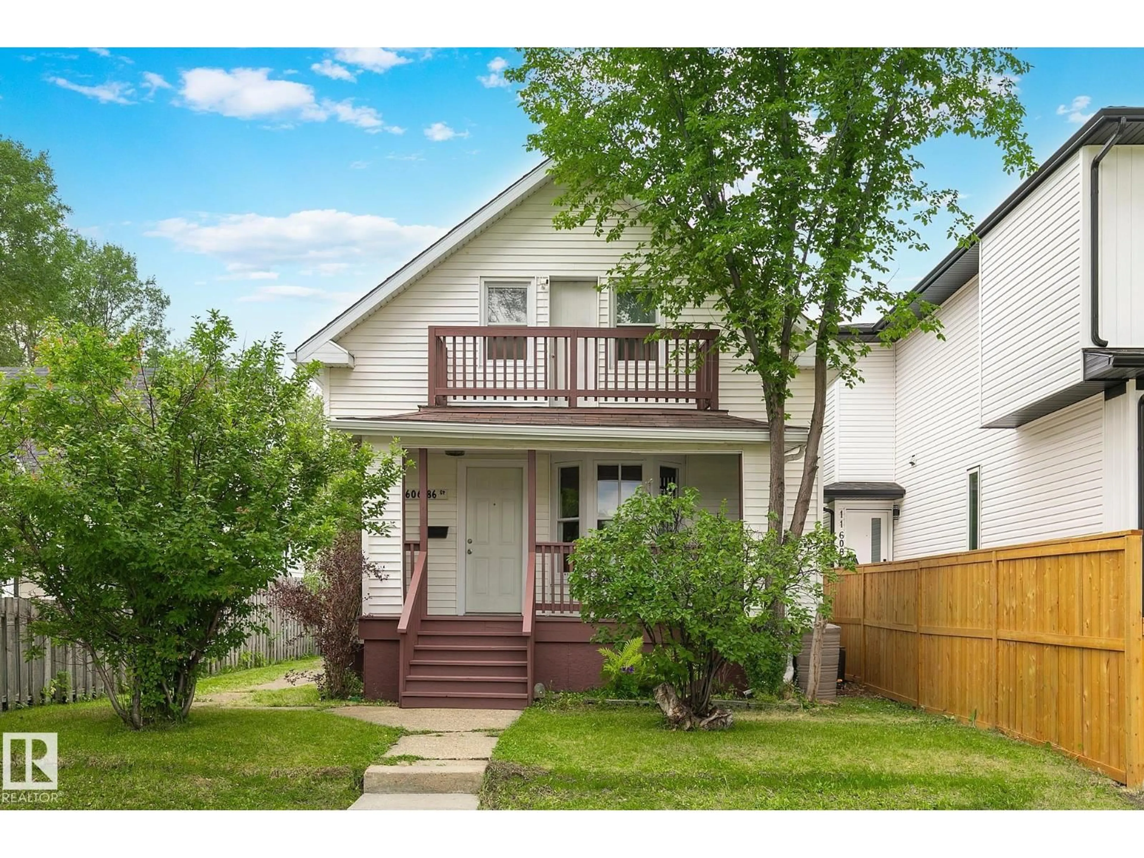 Home with vinyl exterior material, street for NW - 11606 86 ST, Edmonton Alberta T5B3J6