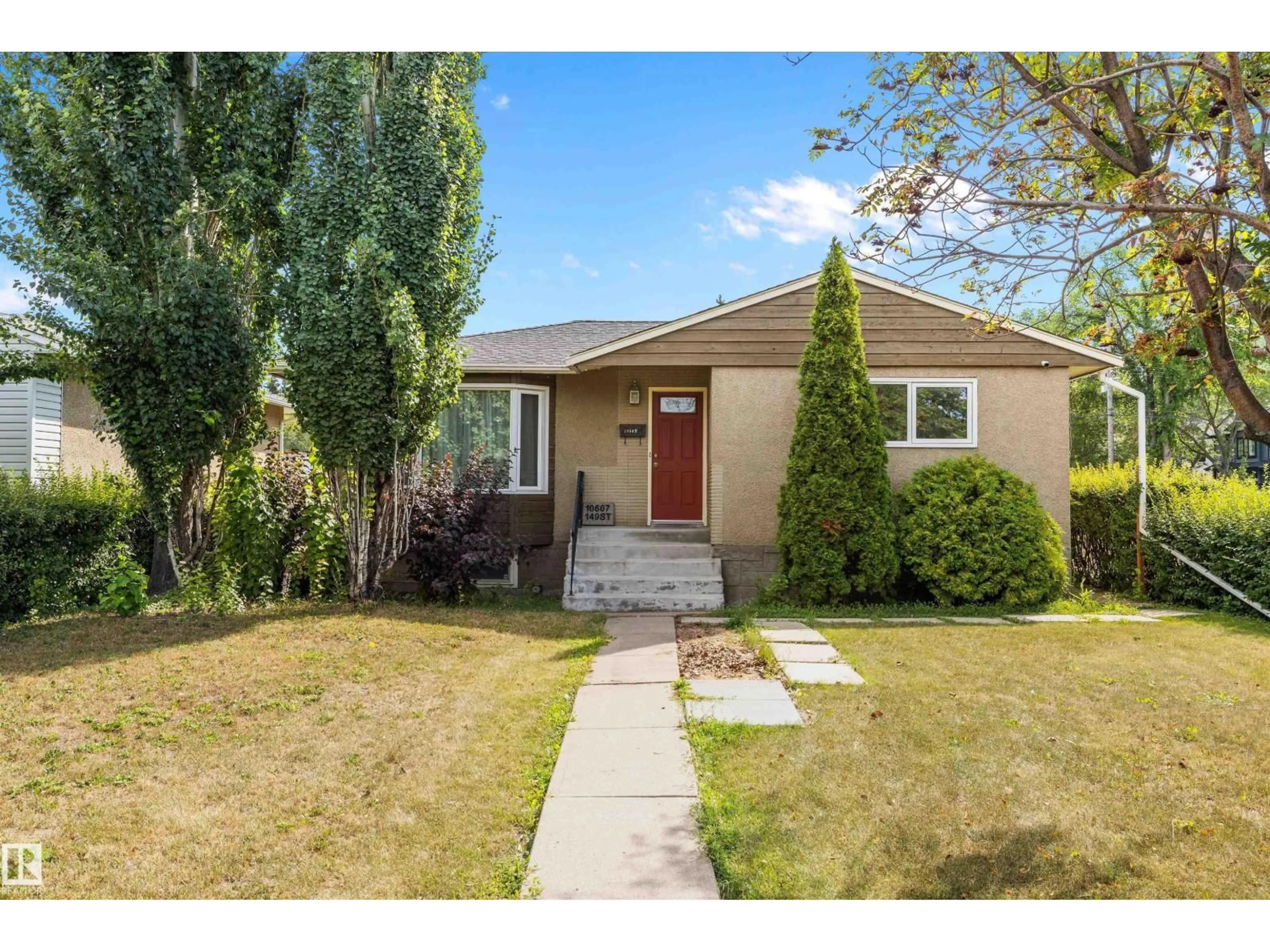 Home with vinyl exterior material, street for 10607 149 ST, Edmonton Alberta T5P1L9
