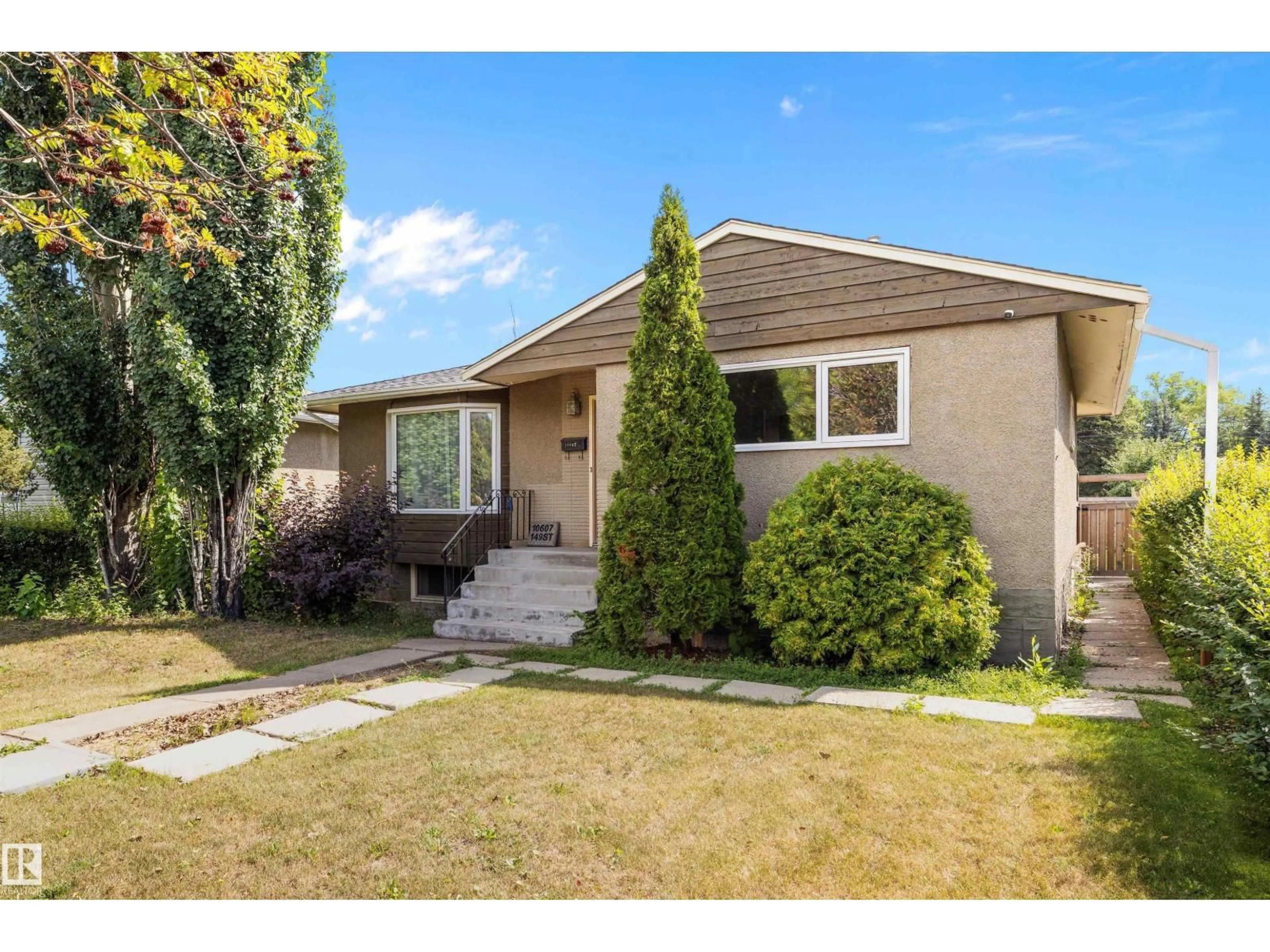 Home with vinyl exterior material, street for 10607 149 ST, Edmonton Alberta T5P1L9