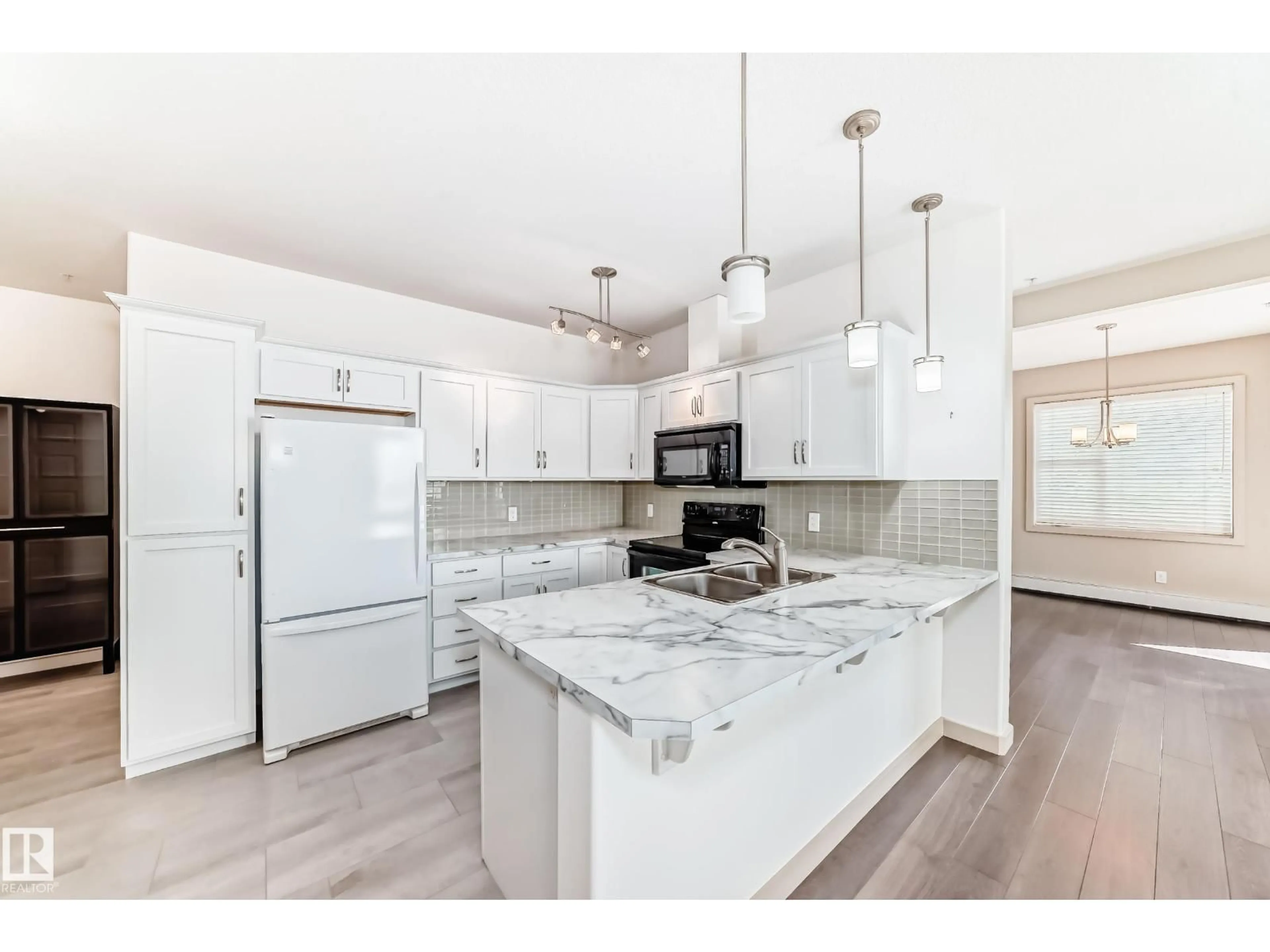 Open concept kitchen, unknown for #202 - 304 AMBLESIDE LINK, Edmonton Alberta T6W0V2