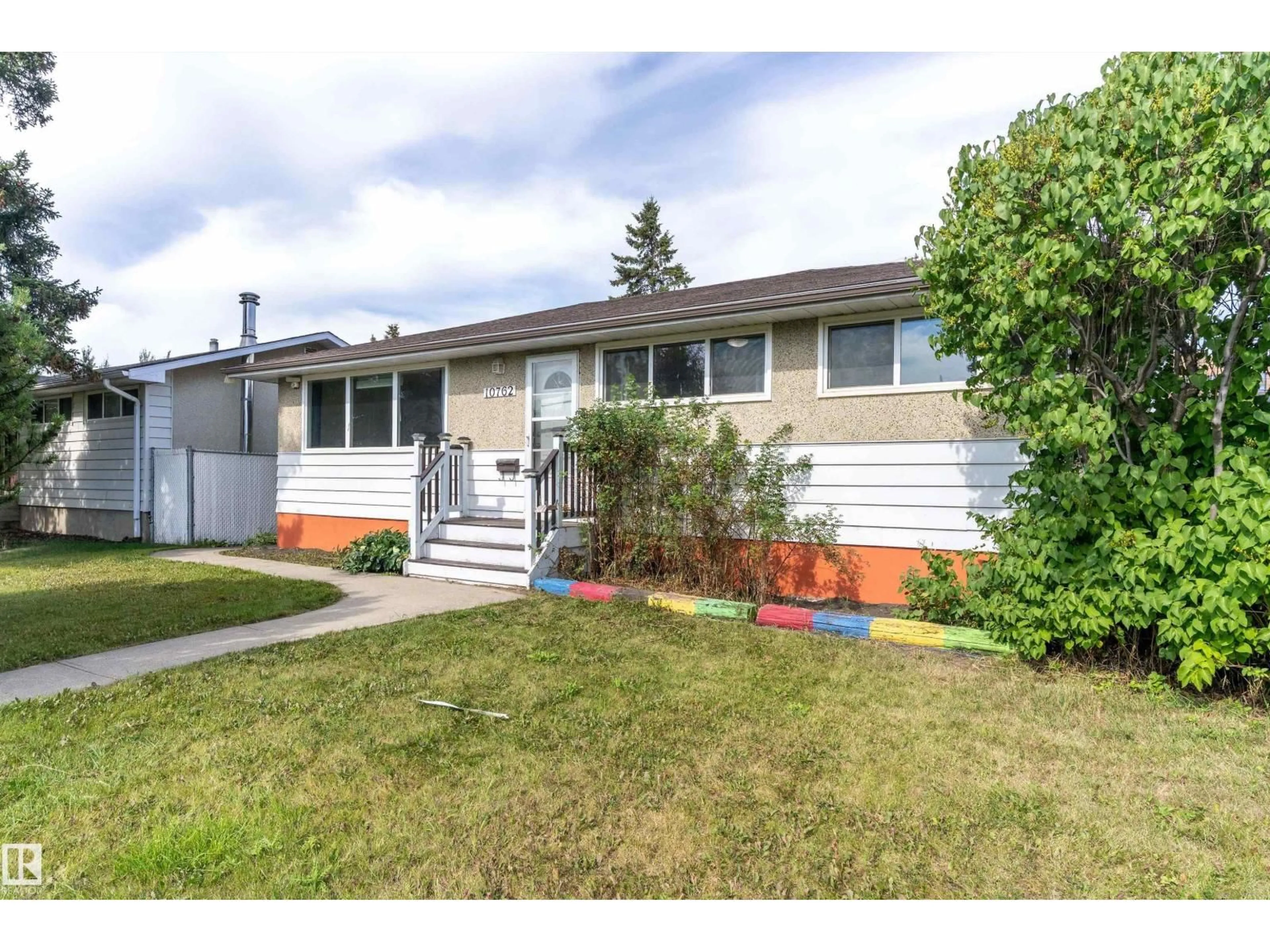Home with vinyl exterior material, street for NW - 10762 164 ST, Edmonton Alberta T5P3R9