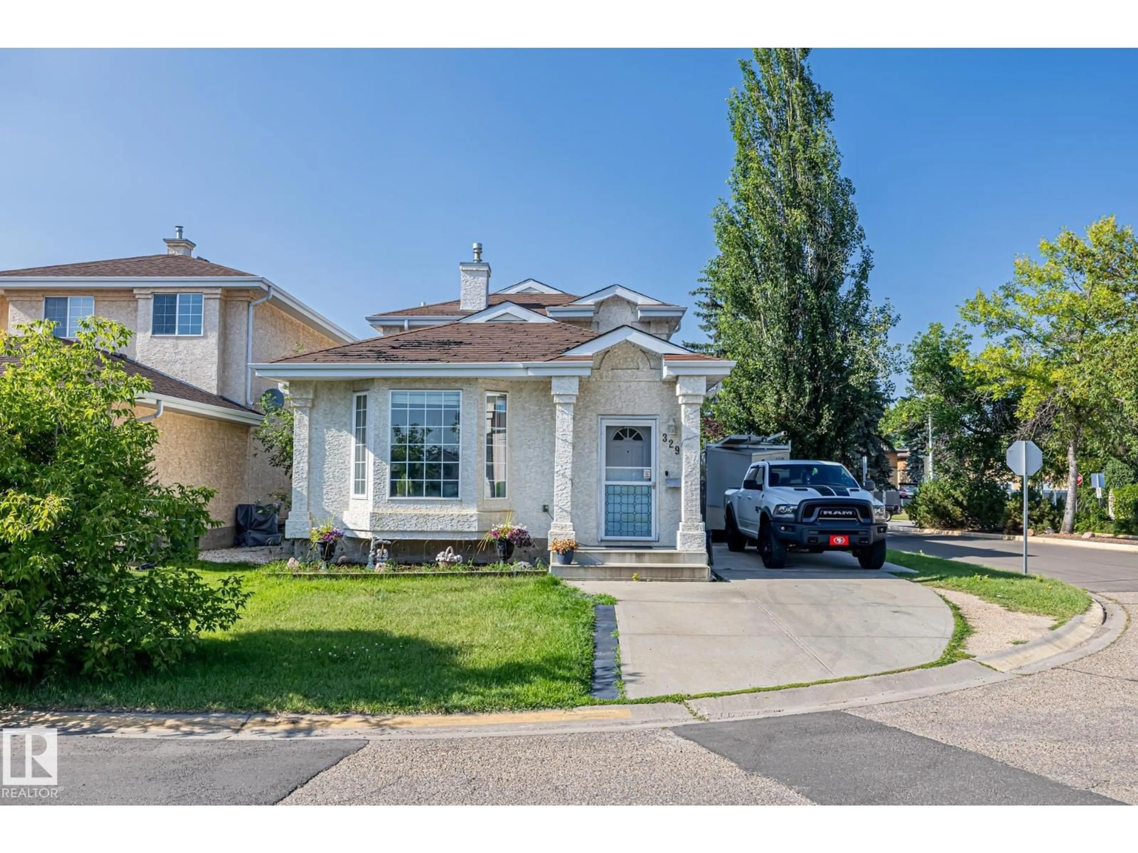 Home with vinyl exterior material, street for NW - 329 RIVER POINT, Edmonton Alberta T5A4Z4