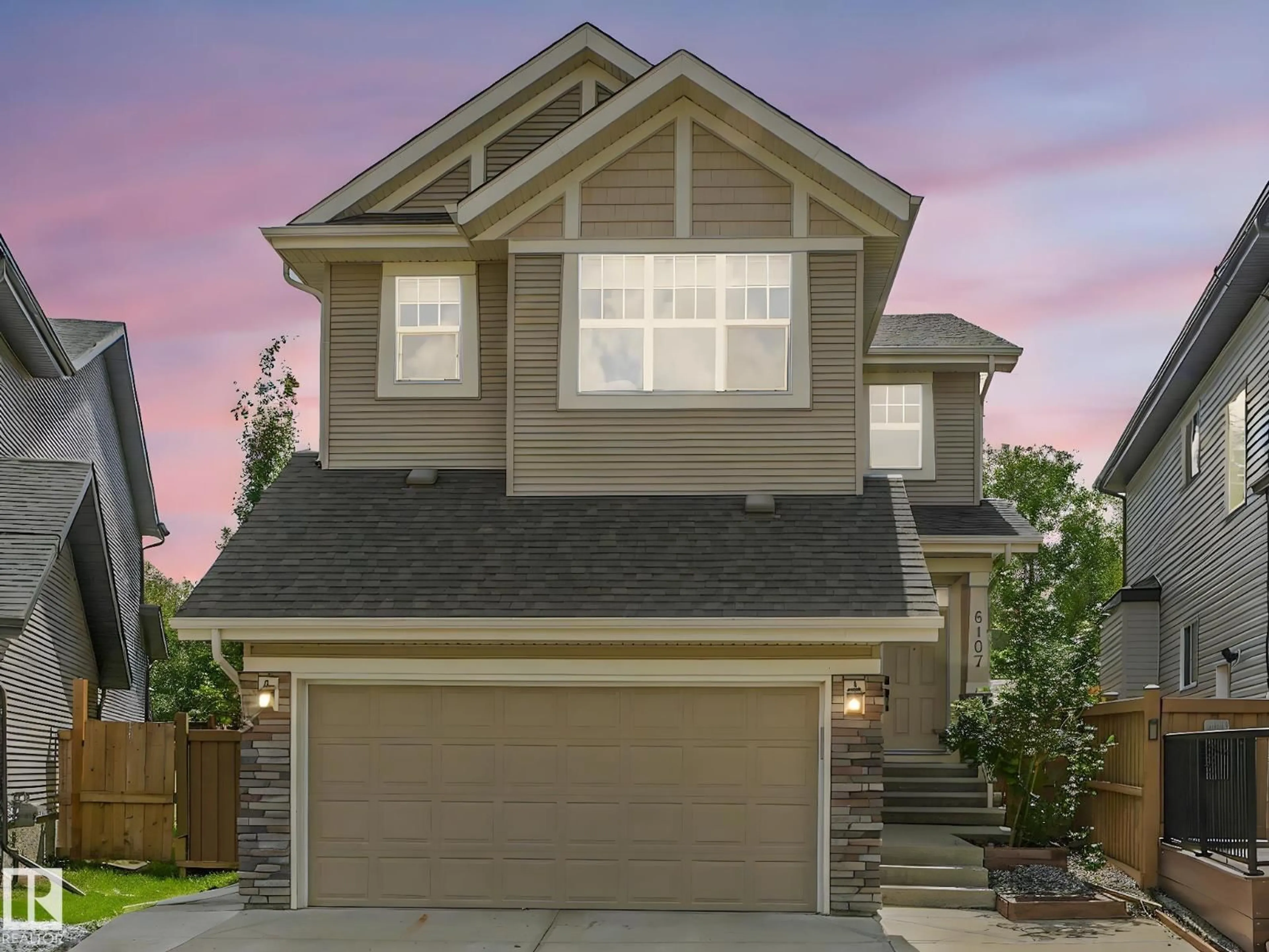 Home with vinyl exterior material, street for NW - 6107 175 AV, Edmonton Alberta T5Y3P2