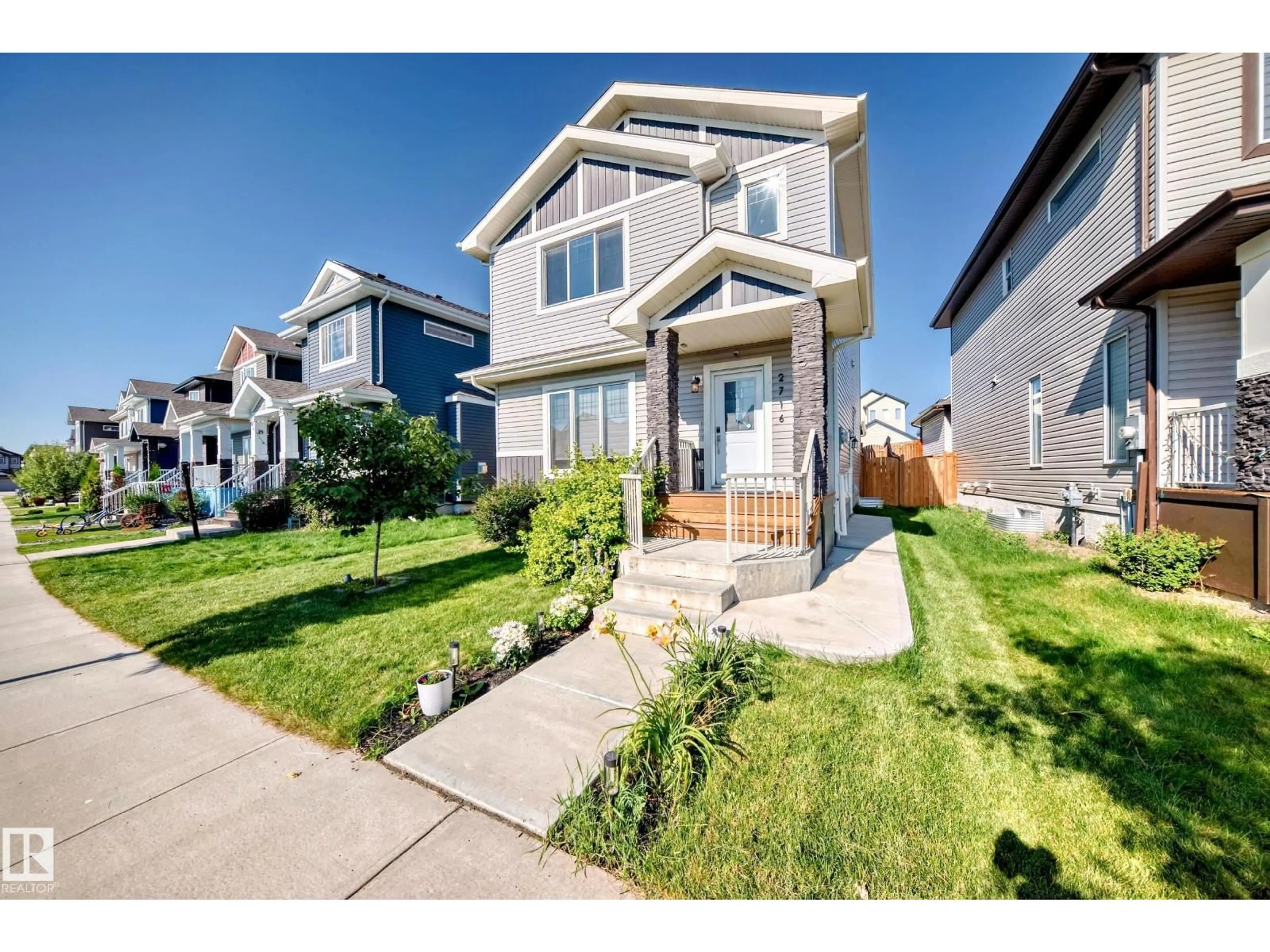 Home with vinyl exterior material, street for 2716 11 ST, Edmonton Alberta T6T0X9