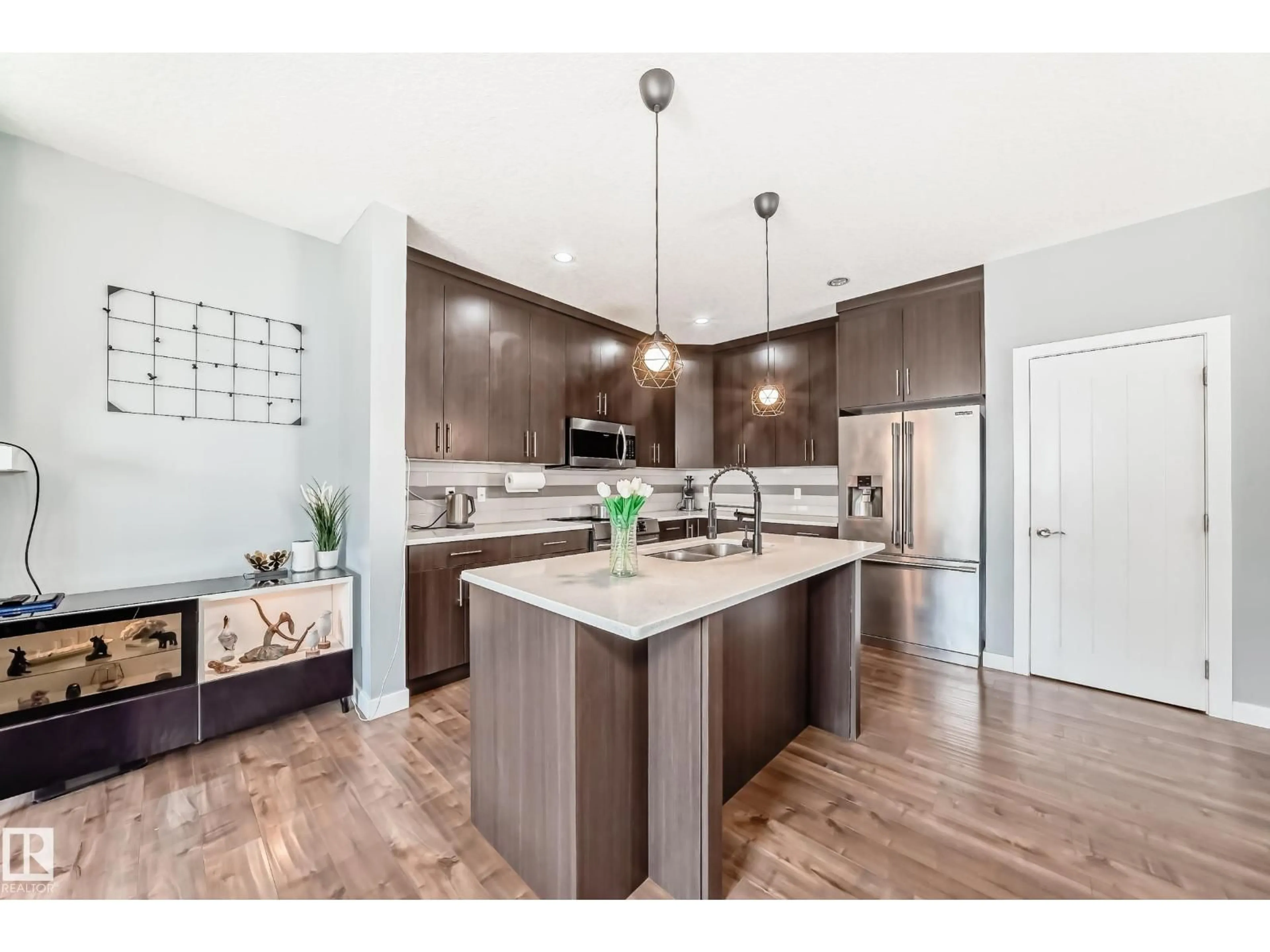 Open concept kitchen, wood/laminate floor for 2716 11 ST, Edmonton Alberta T6T0X9