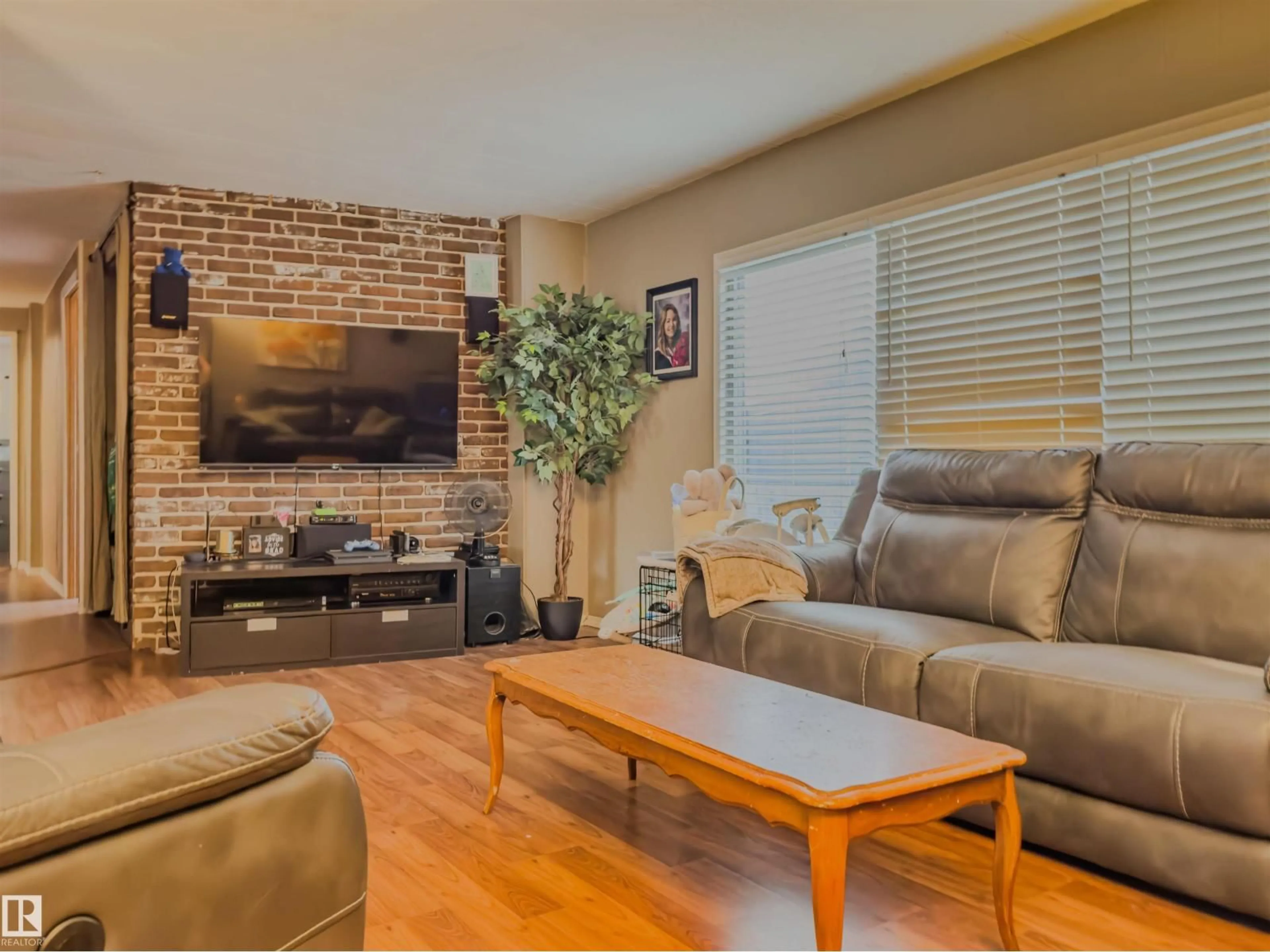 Living room with furniture, wood/laminate floor for 11111 100A AV, Westlock Alberta T7P1N4